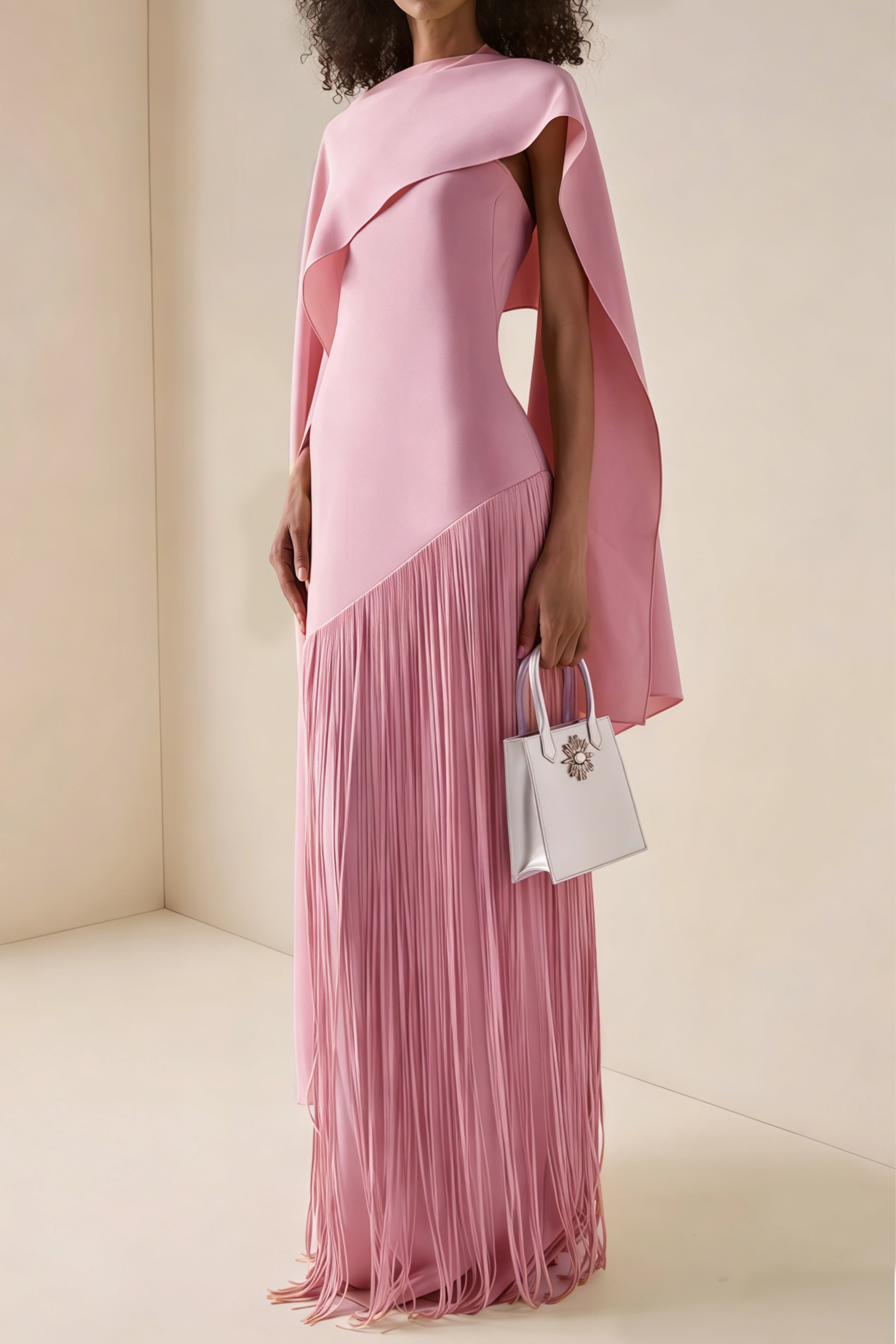Mauve pink cape-style gown with a long fringed skirt