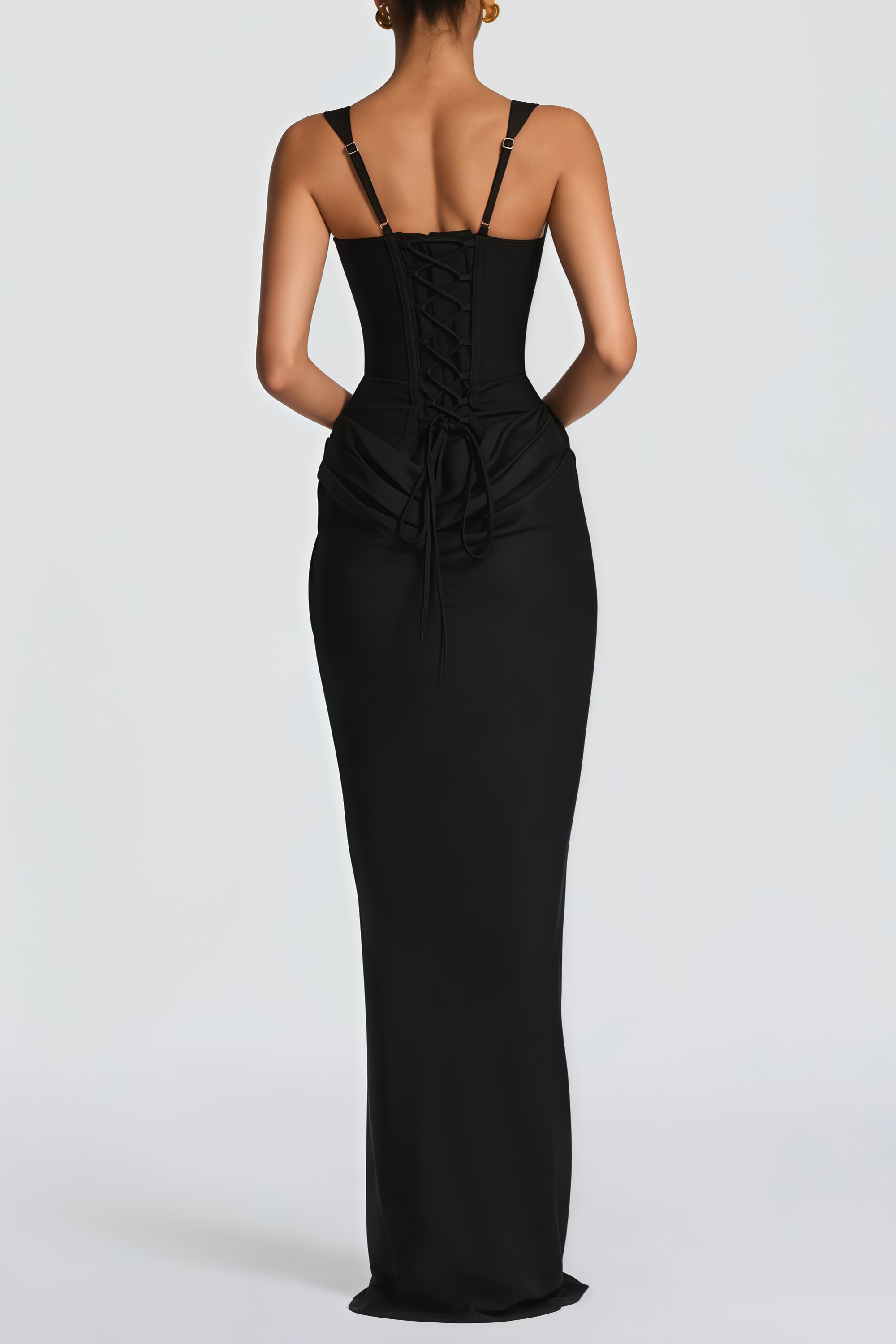Black sleeveless maxi dress with a corset-style bodice and draped hip detailing