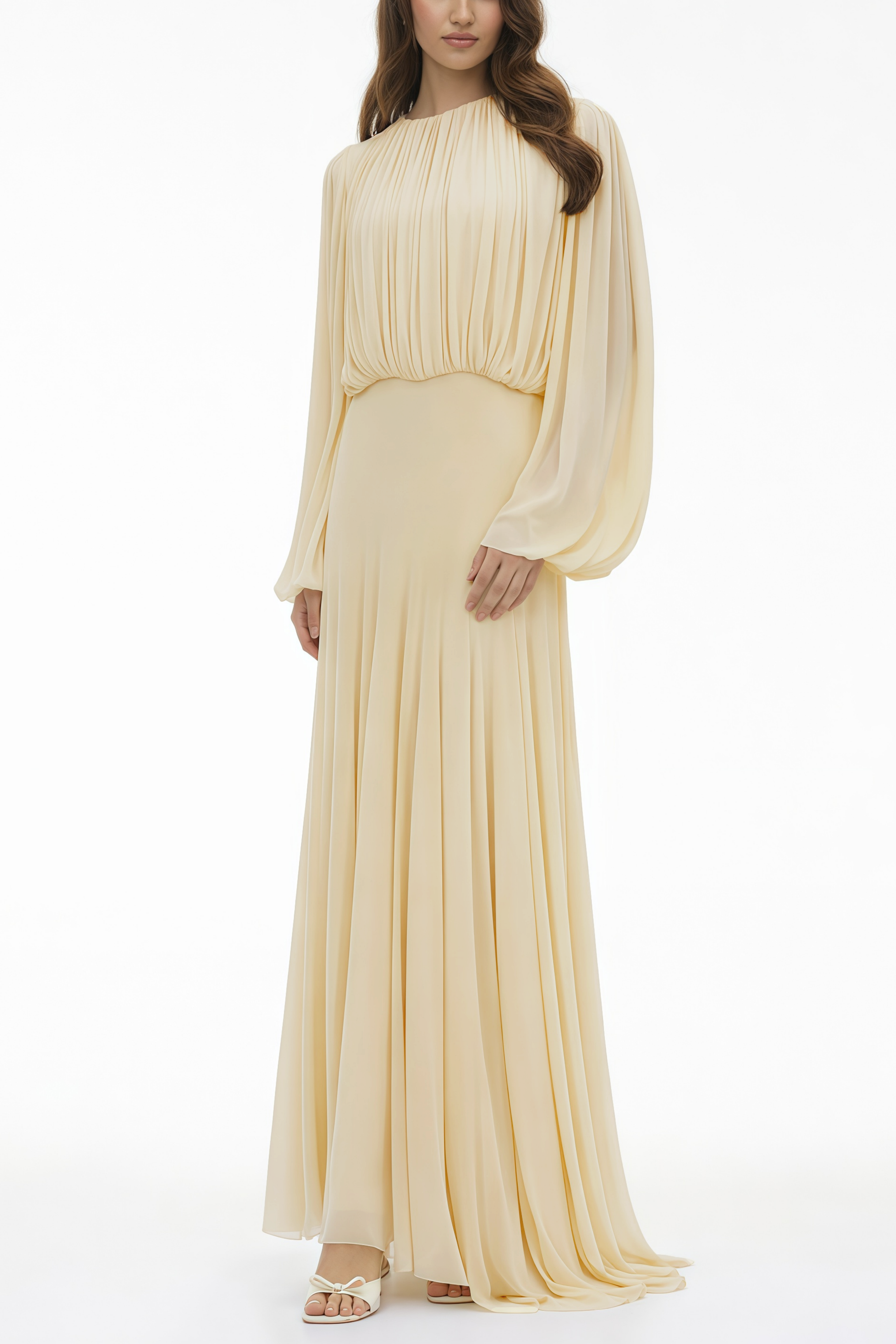 Pale yellow maxi dress with a ruched bodice, high round neckline, and long bishop sleeves