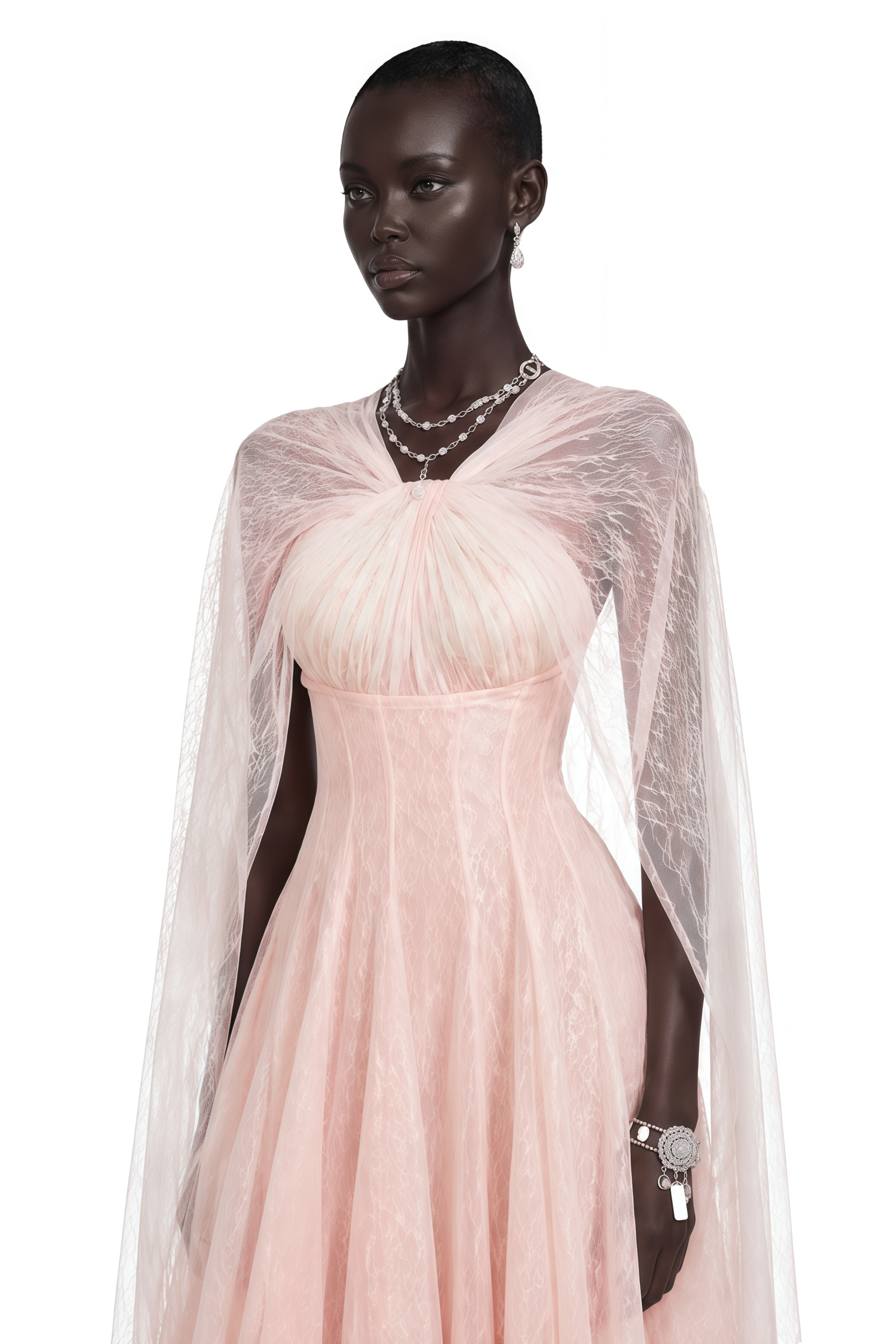 Light pink tulle gown with a corset bodice and matching sheer cape