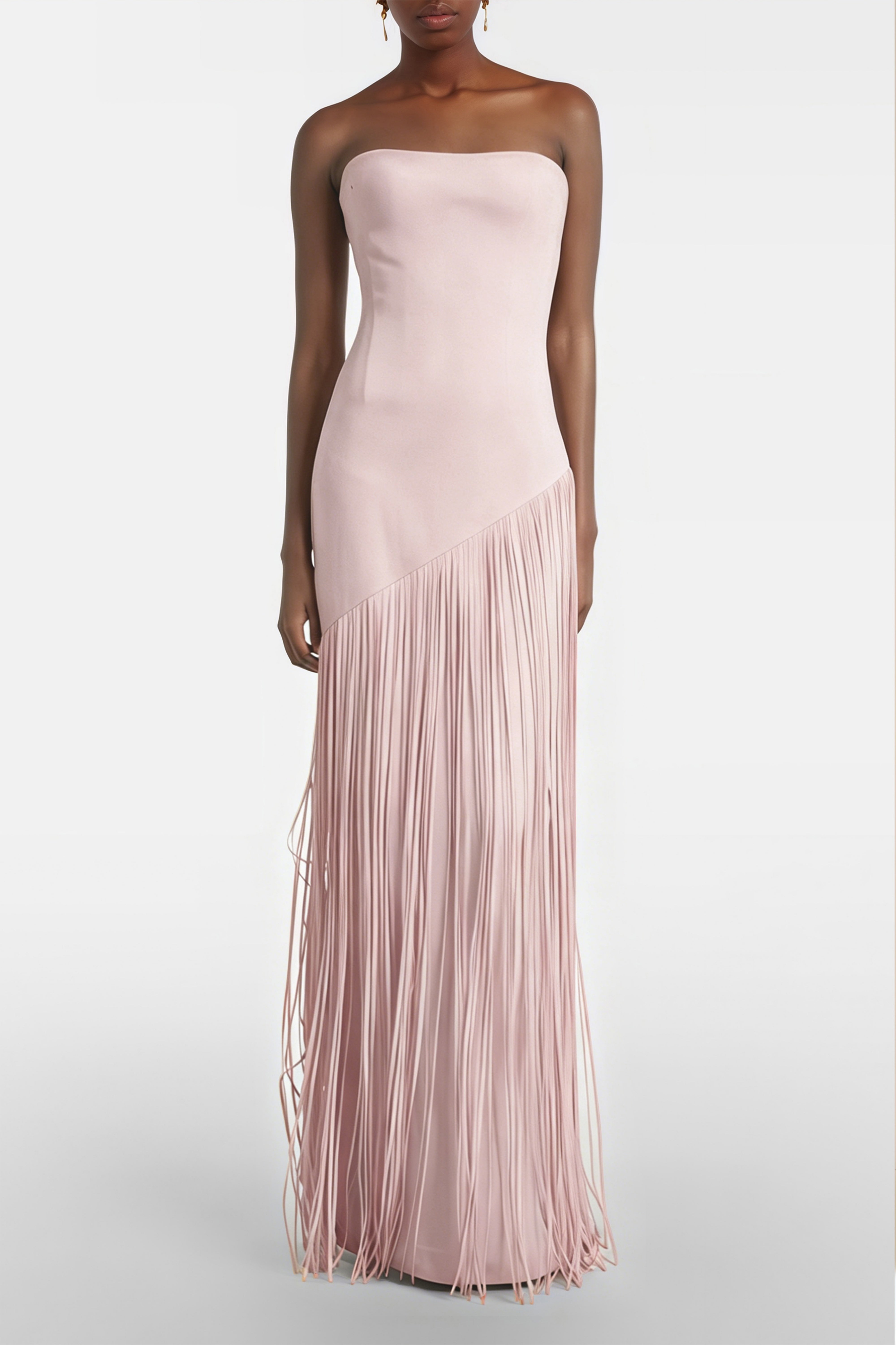 Light pink cape maxi dress with an asymmetrical waist and long fringe skirt