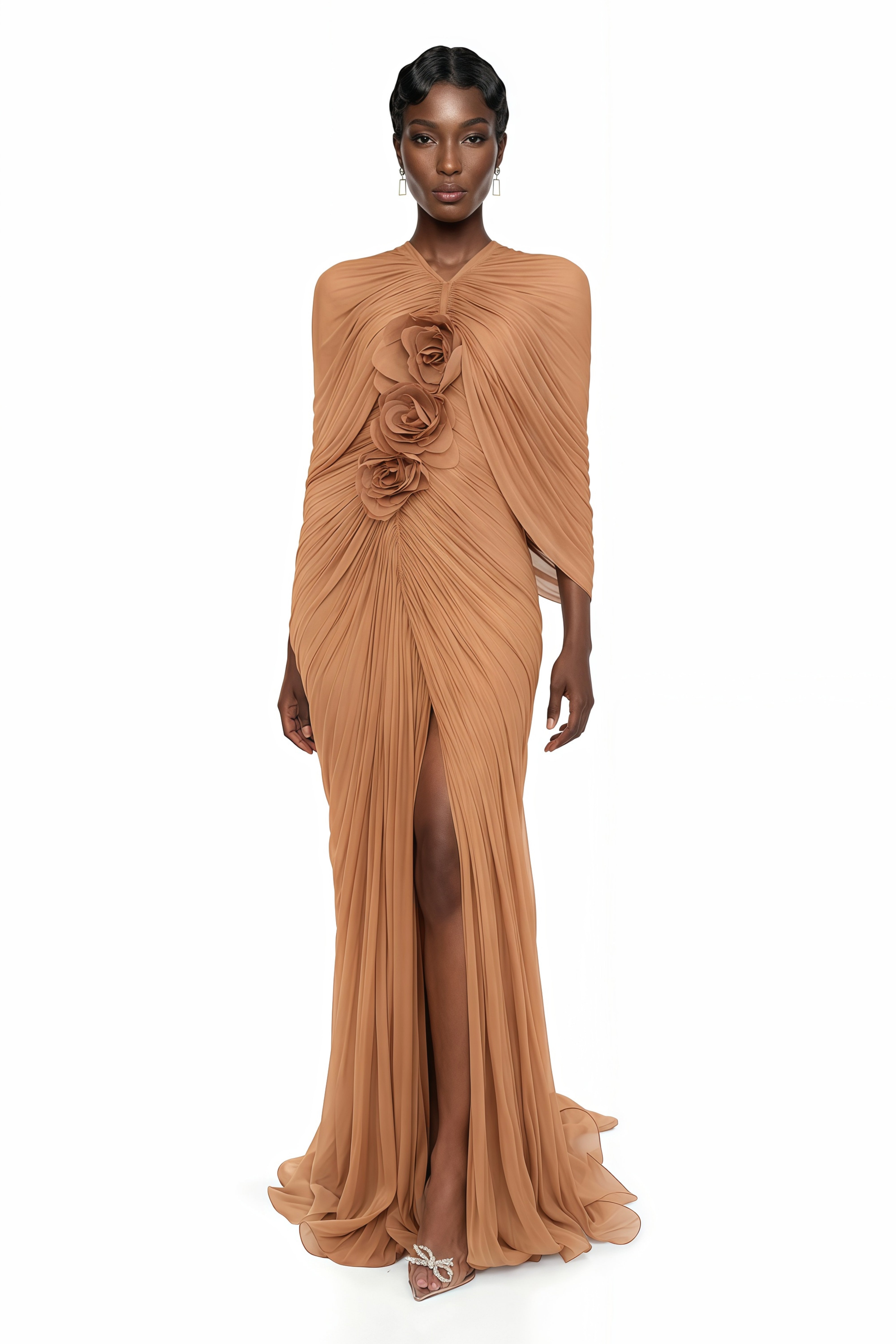 Tan ruched maxi dress featuring a built-in cape overlay and a vertical row of 3D fabric rosettes