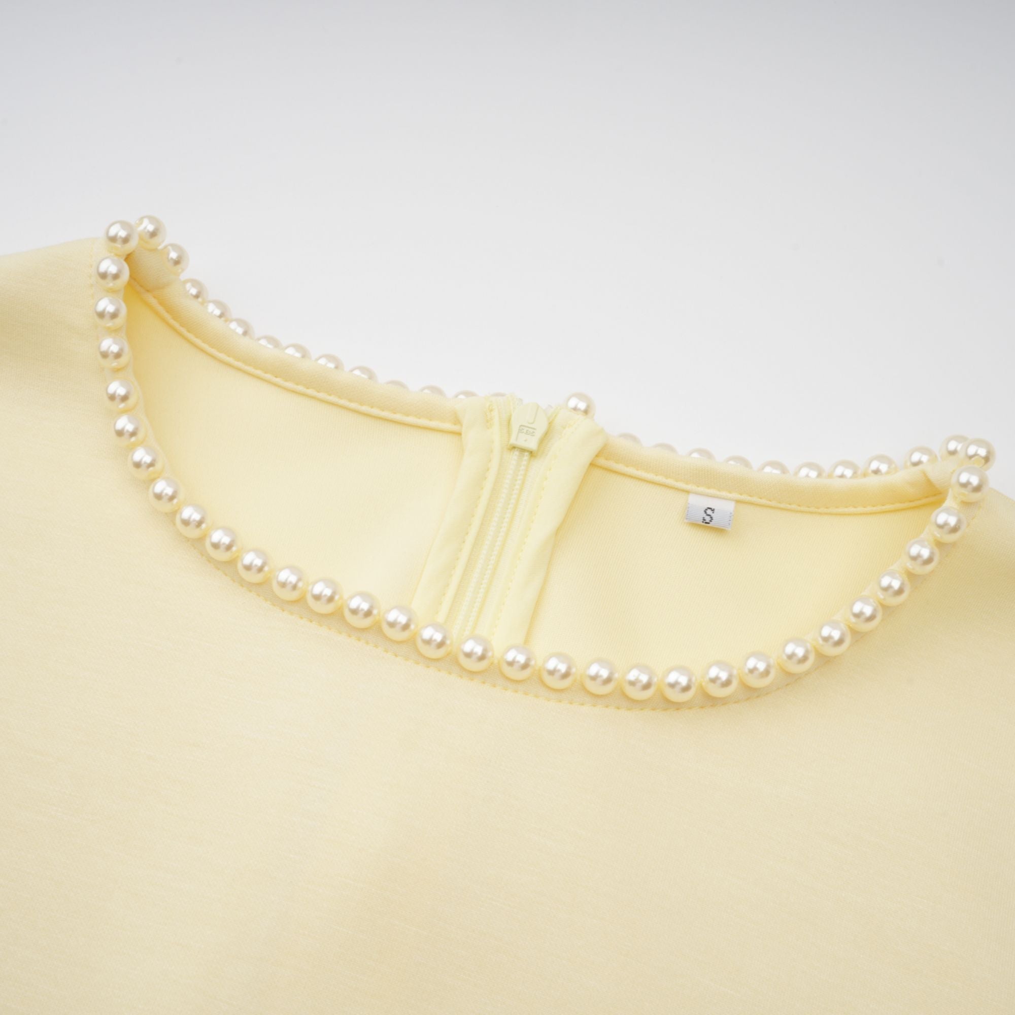Light yellow long-sleeve maxi dress with a matching beaded cape overlay