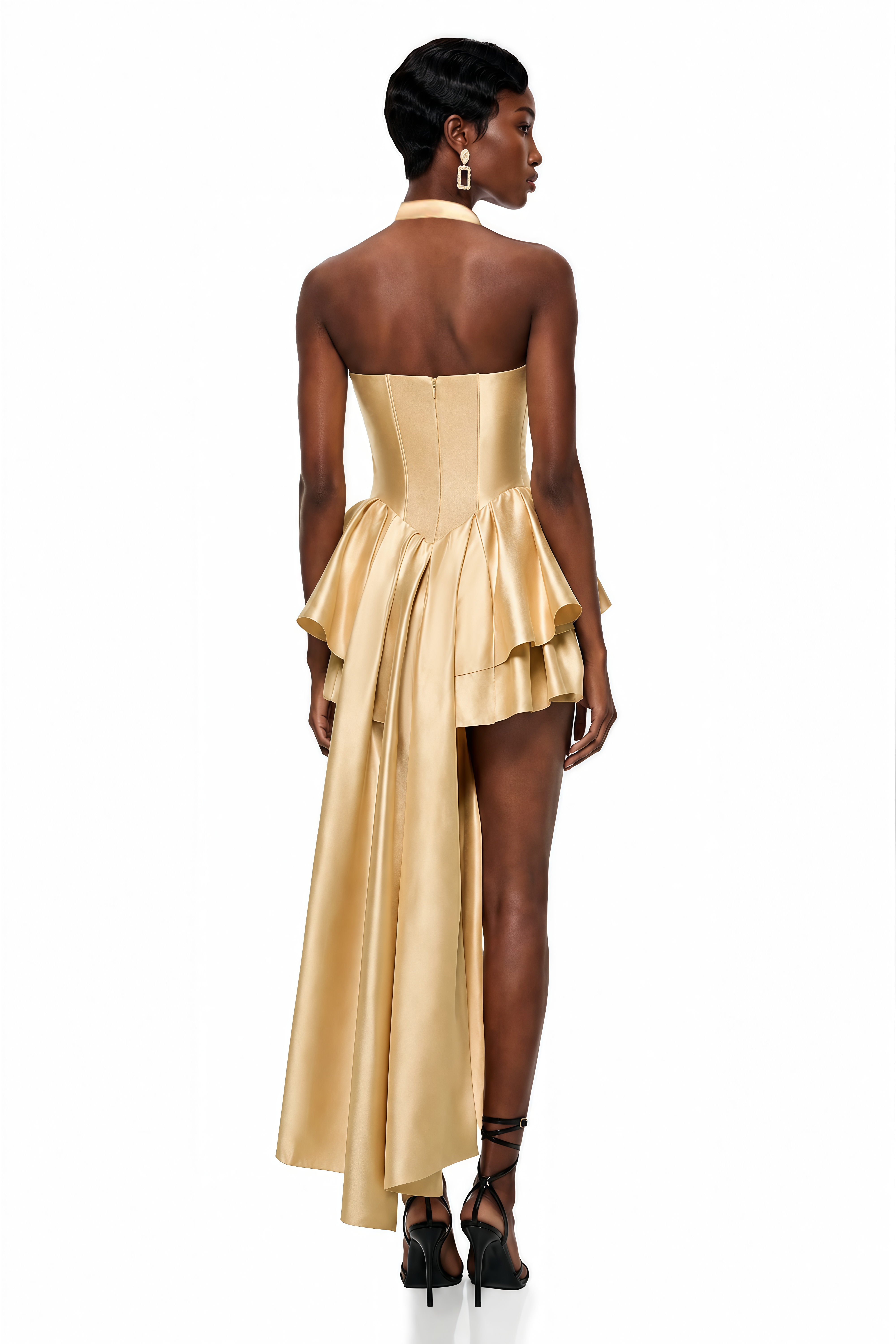 Gold satin high-low dress with a crisscross halter neckline, structured corset bodice, and layered ruffled skirt