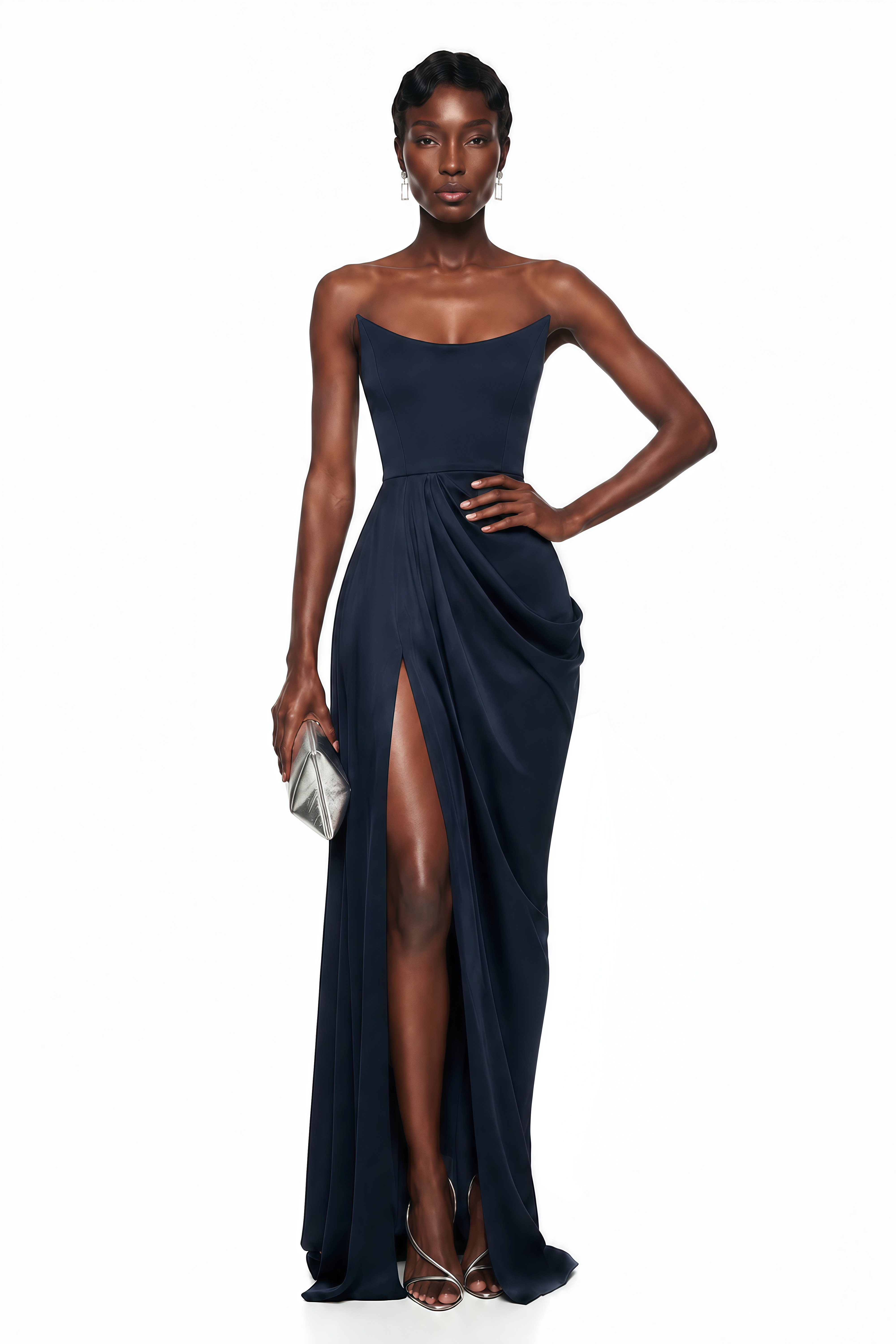 Navy blue strapless maxi dress with a fitted curved bodice, draped wrap skirt, and high thigh-high slit