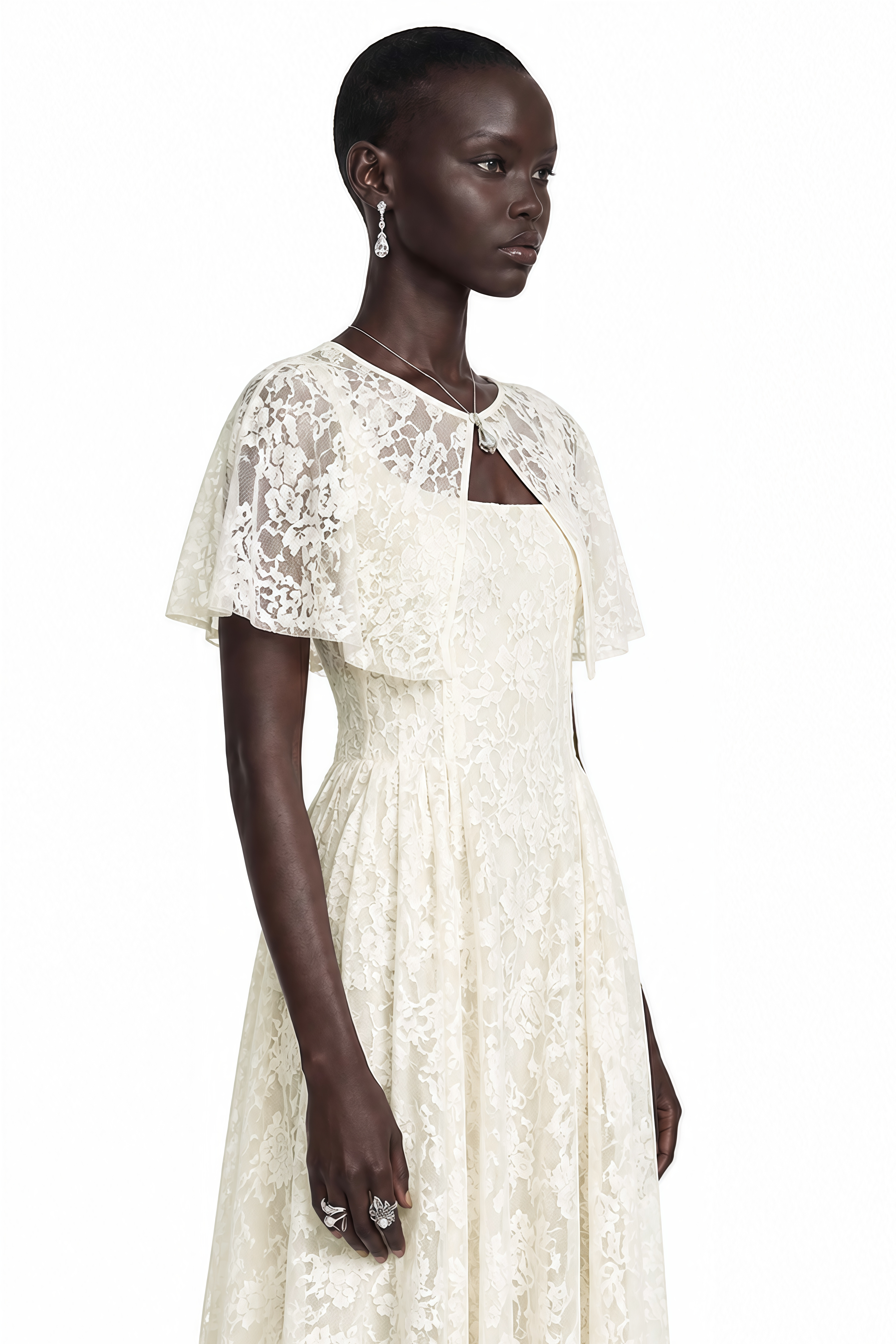 White lace midi dress with a fitted waist, cutout neckline, and short flutter cape sleeves