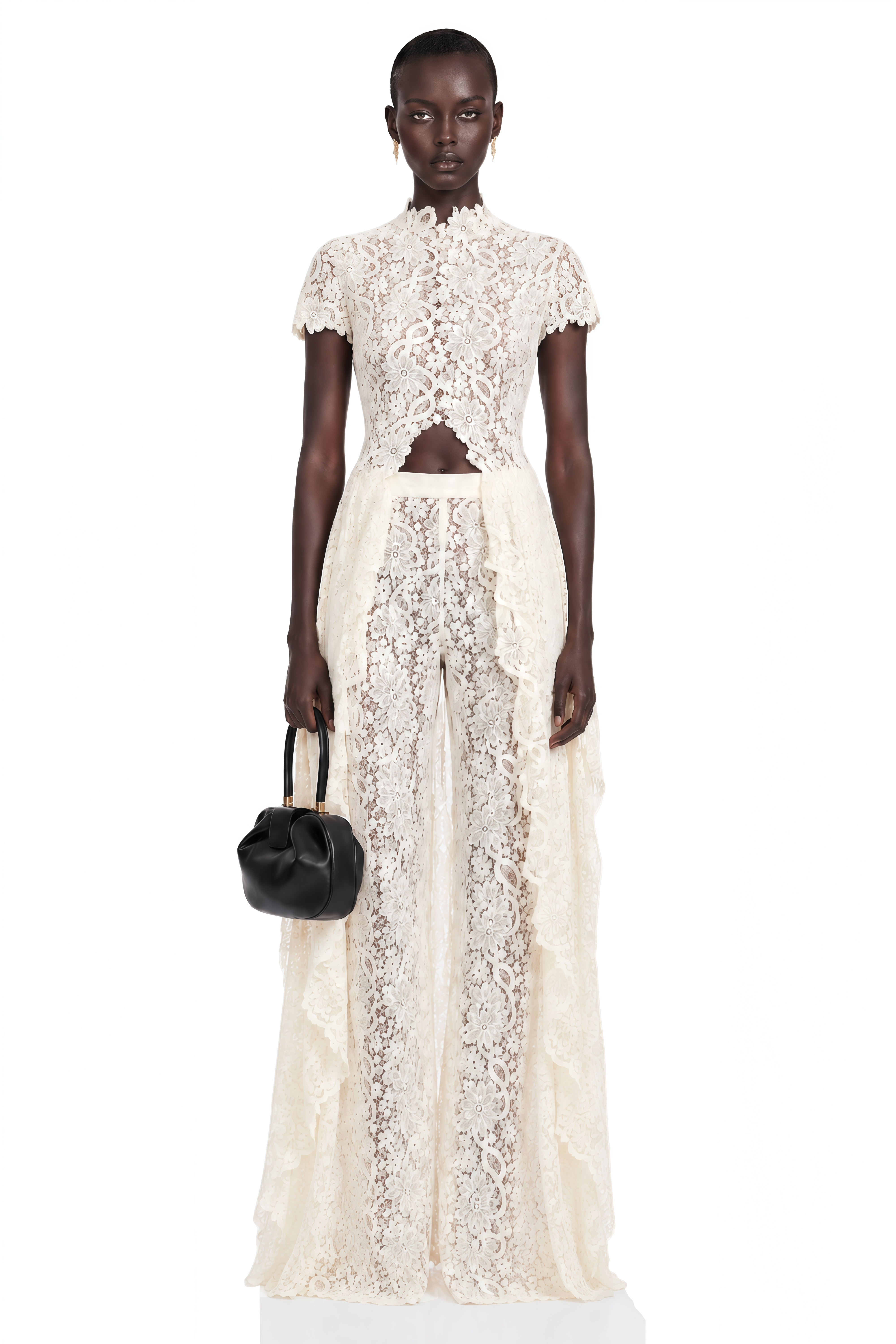 Black long-sleeve maxi dress with a sheer lace bodice and a draped skirt