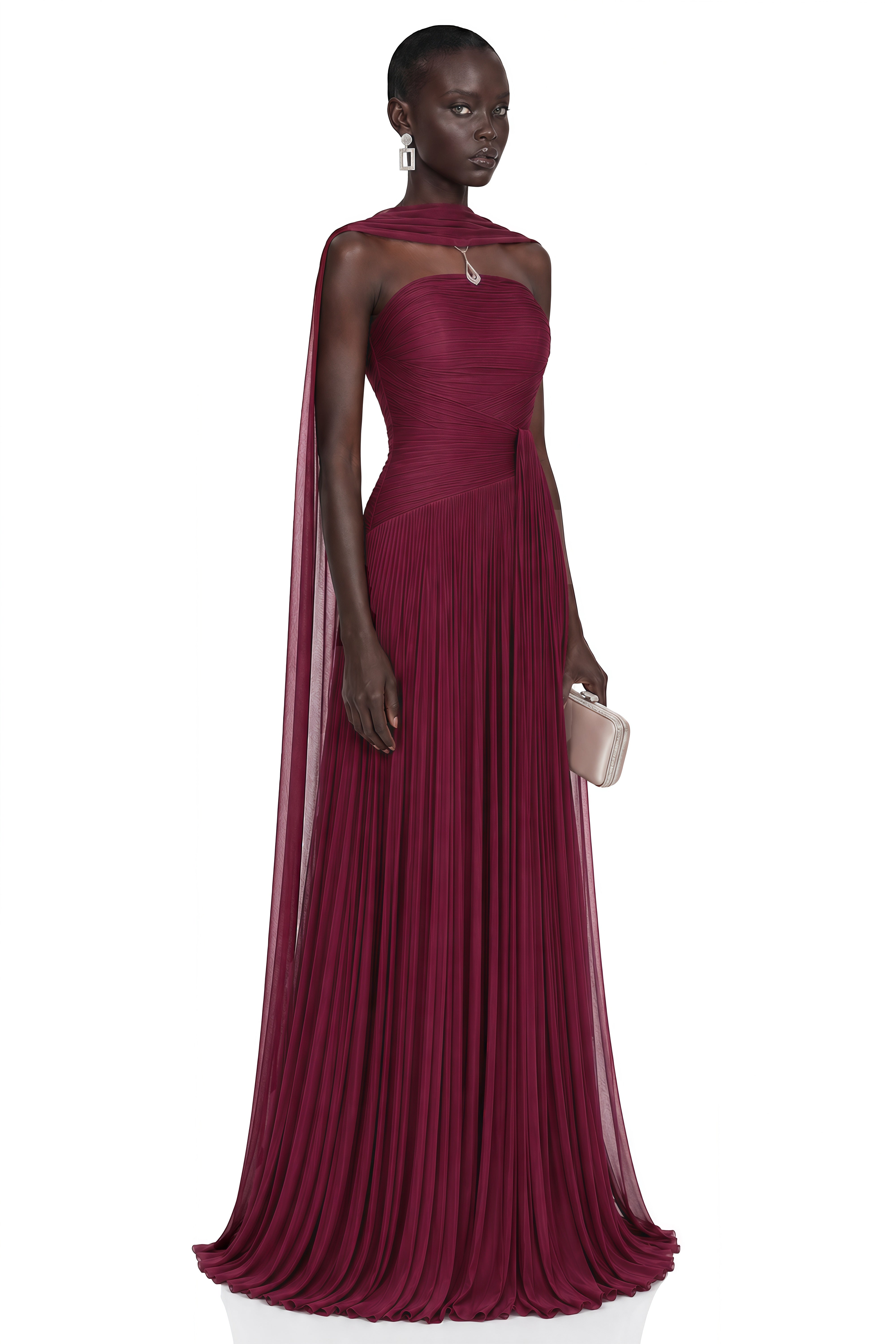 Burgundy strapless pleated maxi dress with a matching cape overlay