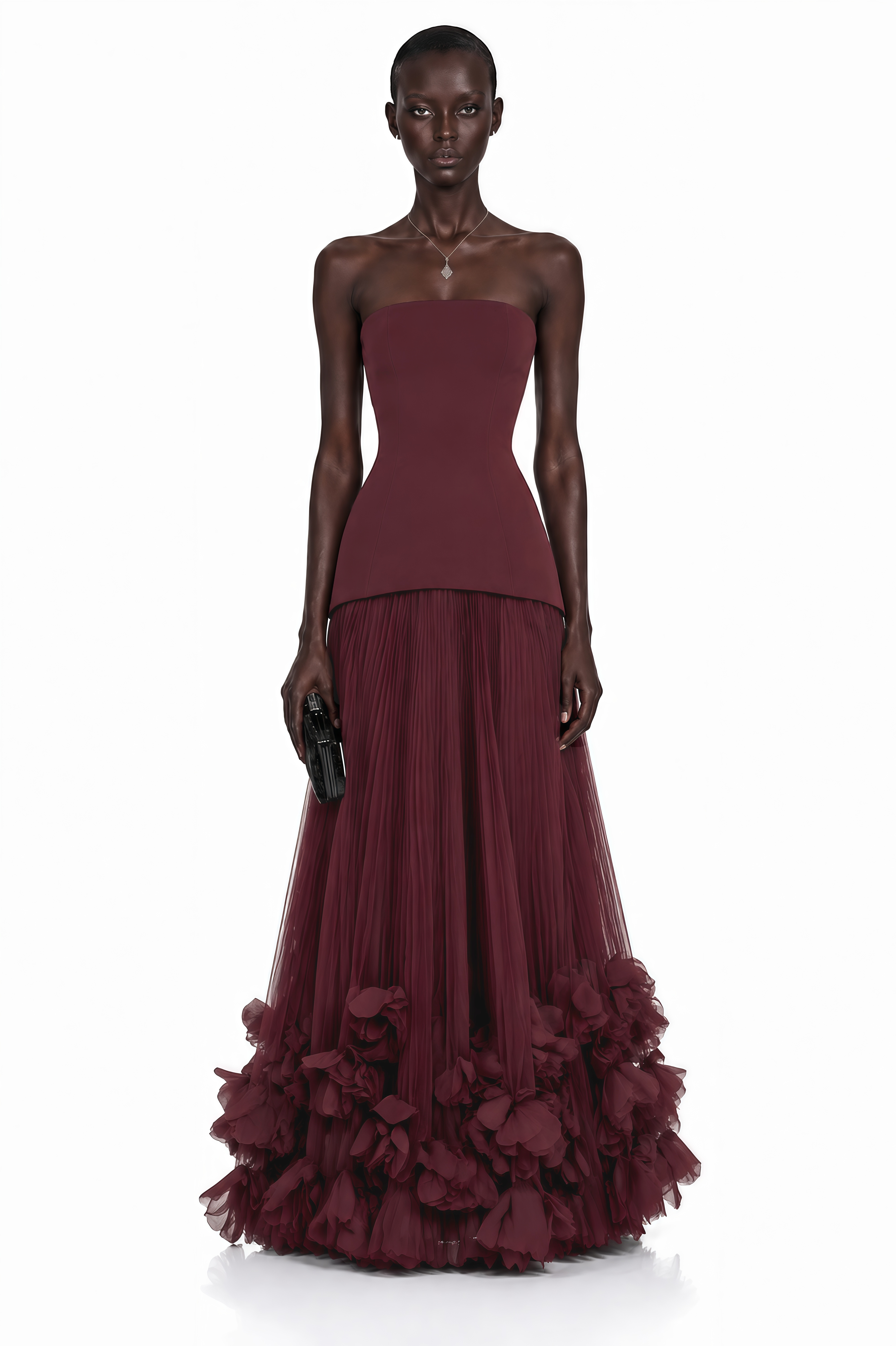 Burgundy strapless maxi dress with a drop-waist bodice and pleated tulle skirt featuring a ruffled hem