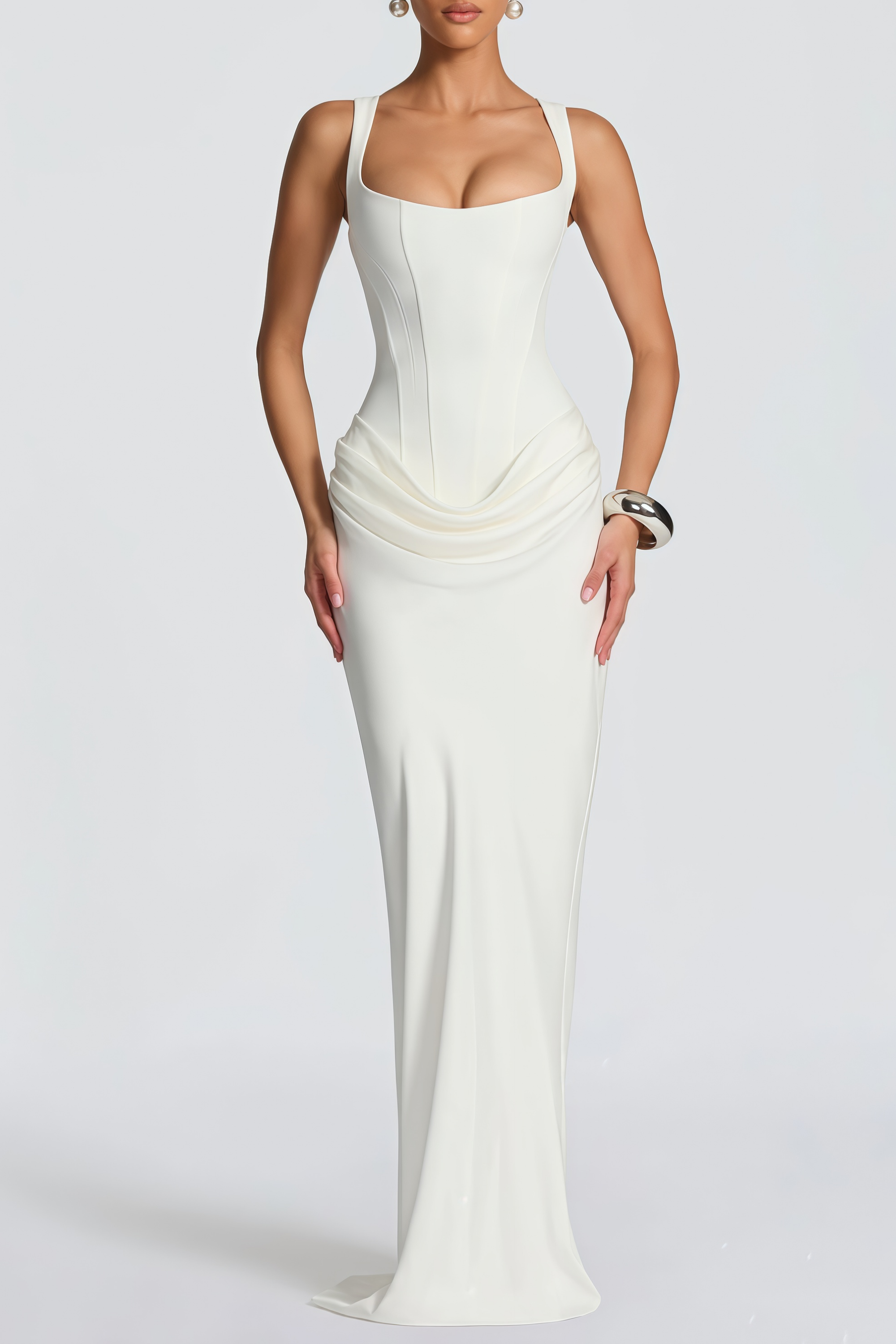 White sleeveless maxi dress with a corset-style bodice and draped hip detailing