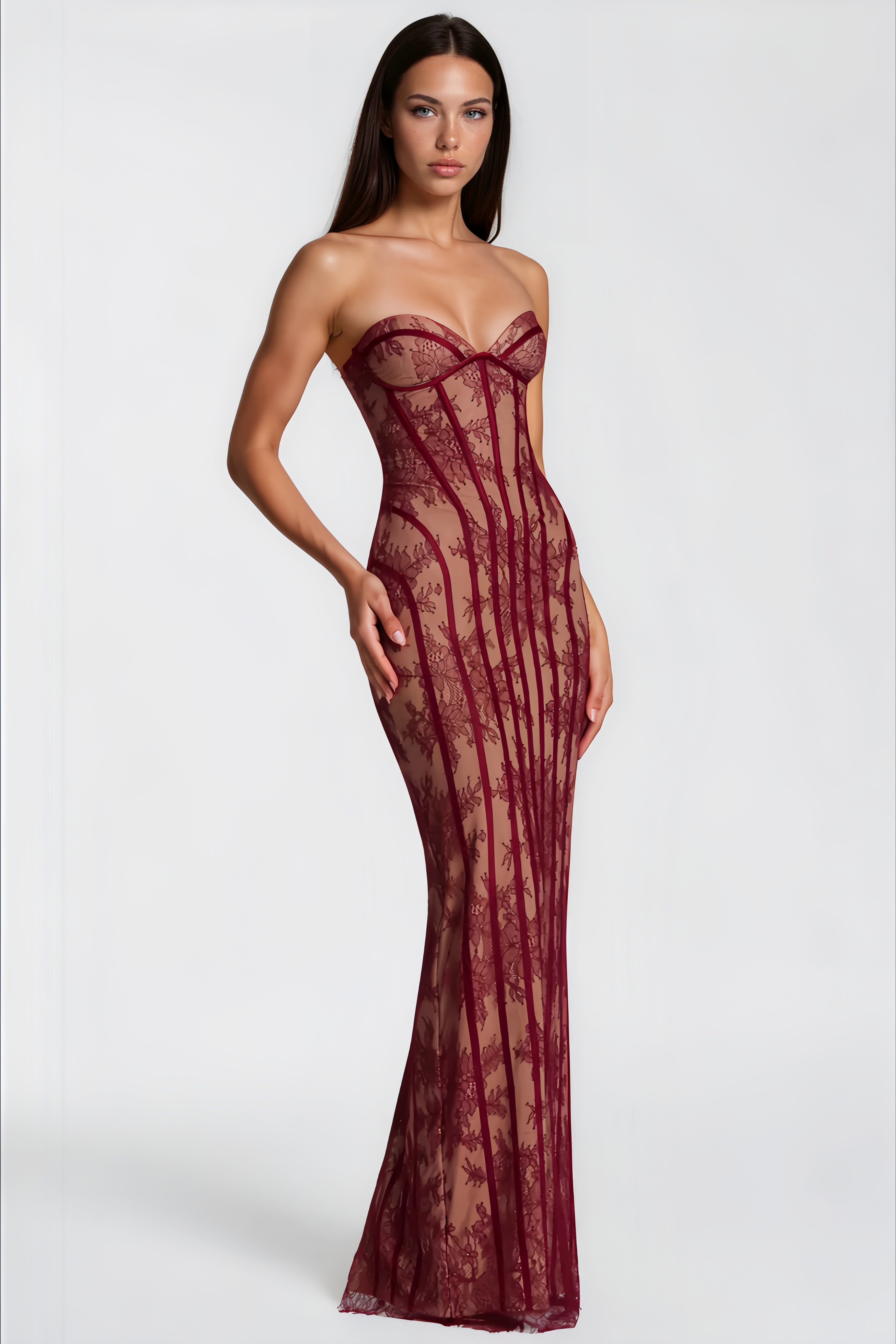 Burgundy strapless maxi dress featuring a nude lining with floral lace overlay and structured corset boning