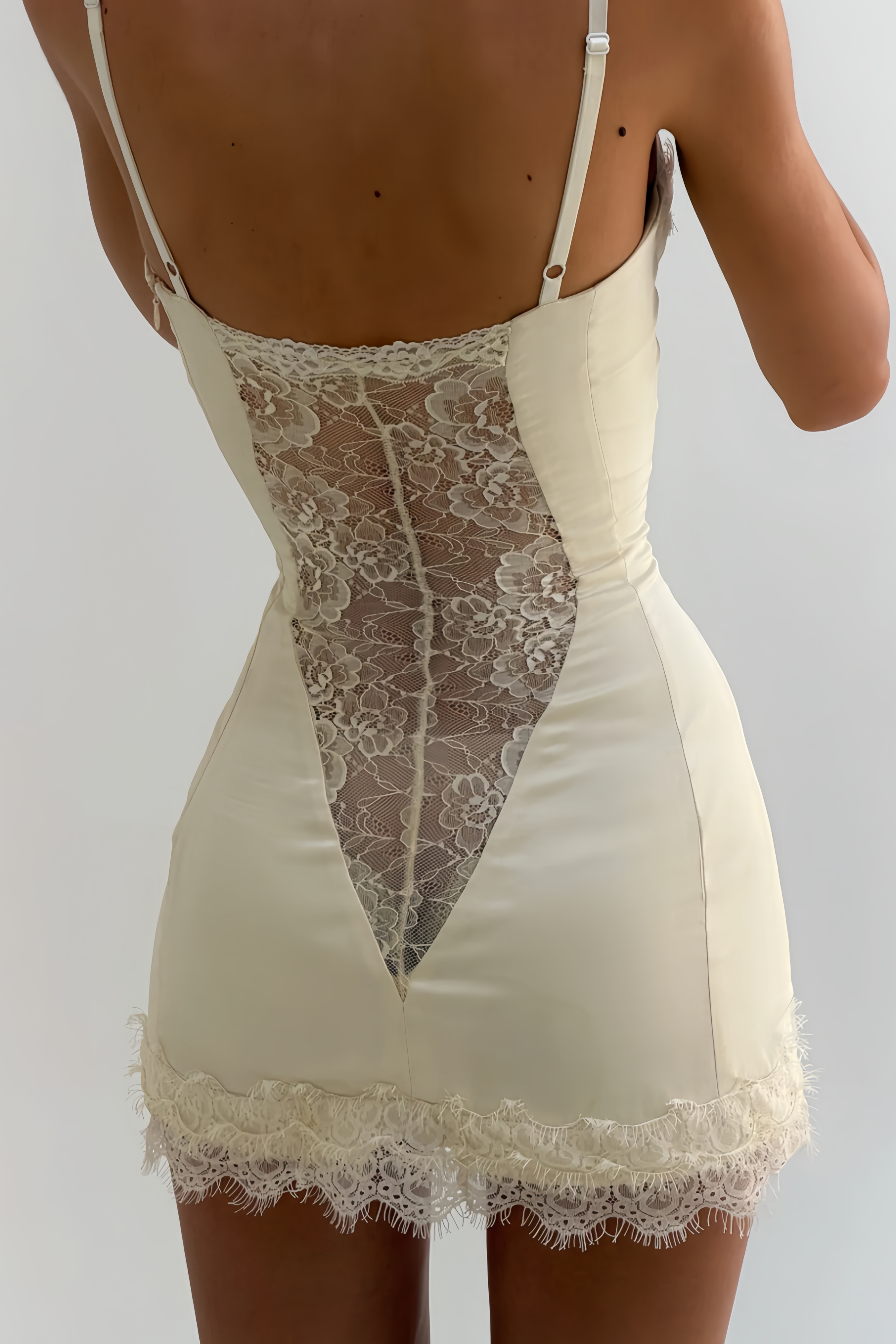 White satin corset mini dress with lace inserts and trim