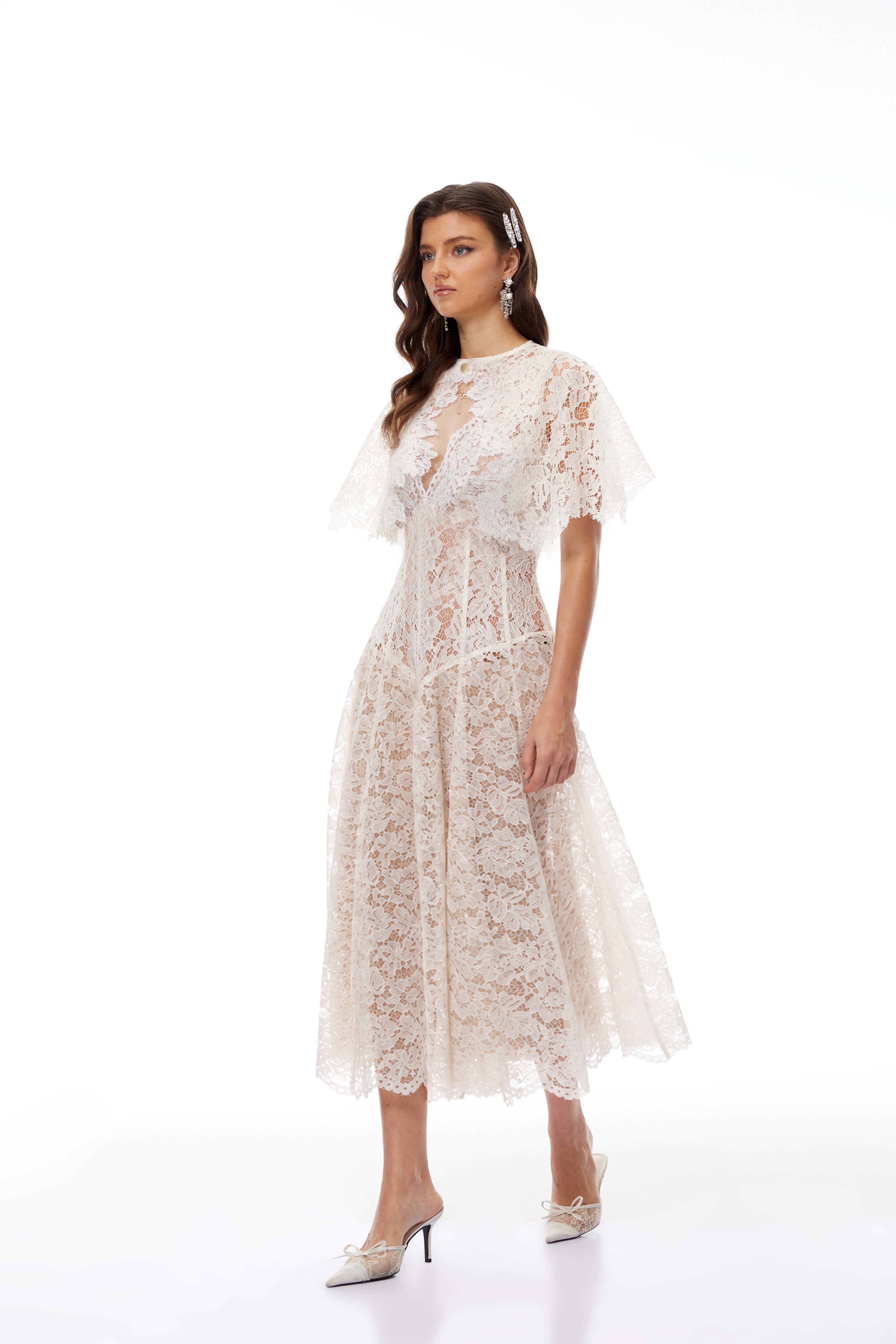 White lace midi dress with a keyhole neckline and a flared skirt over a nude lining