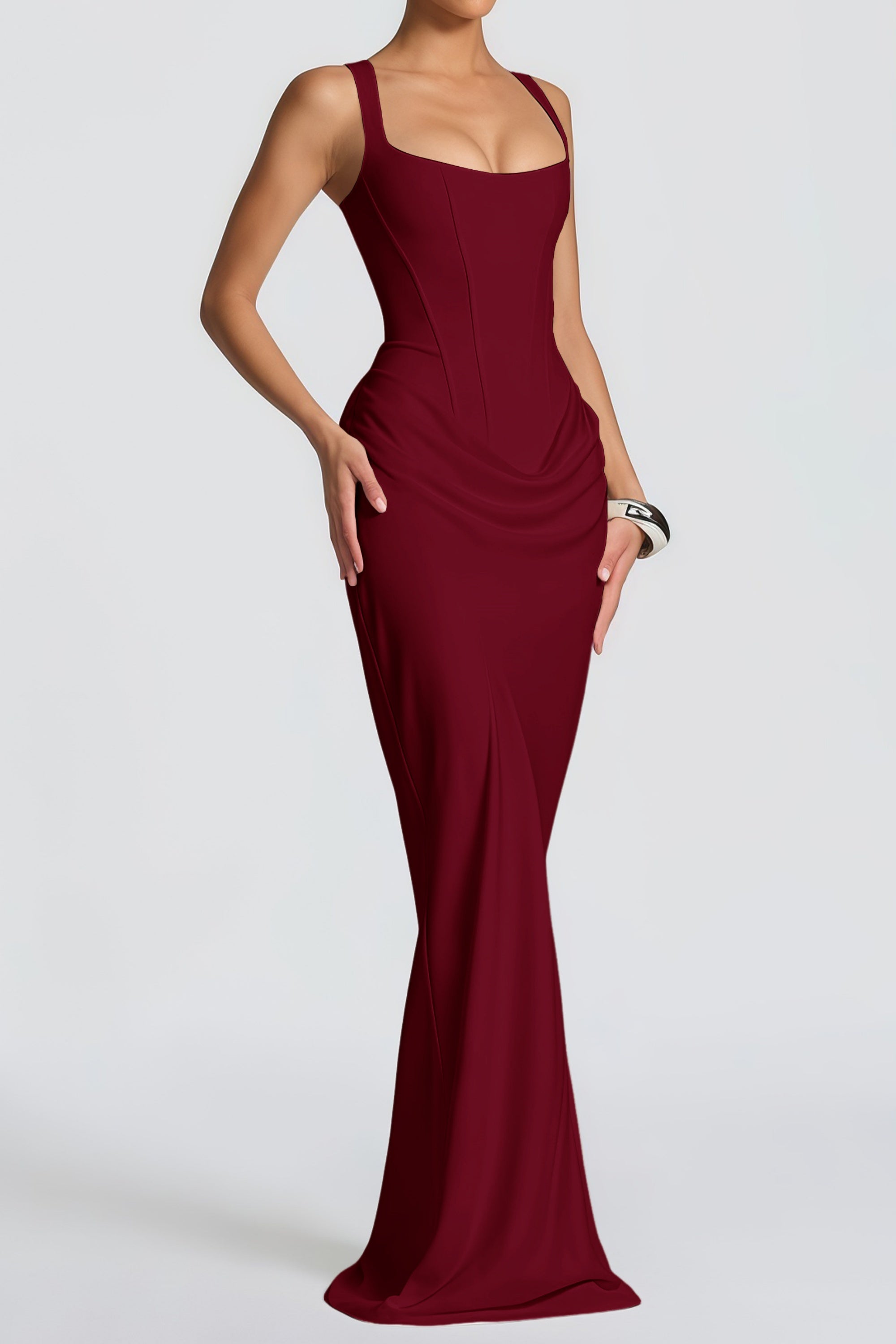 Burgundy floor-length gown with a corset-style bodice and draped hip detail
