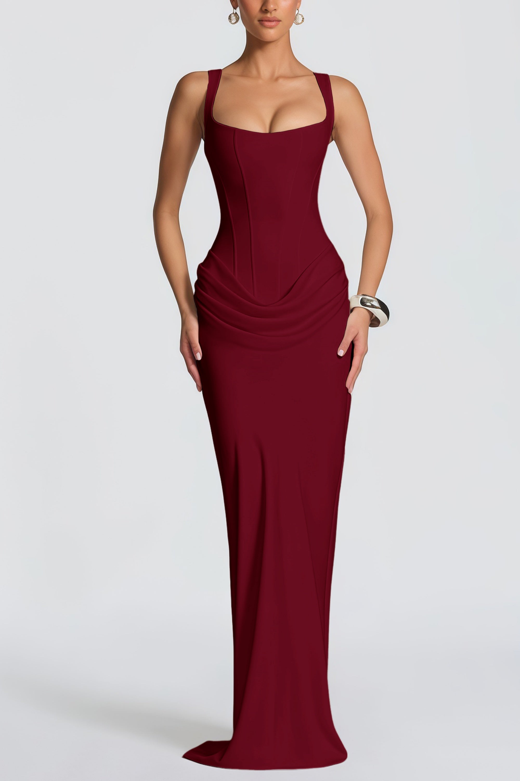 Burgundy floor-length gown with a corset-style bodice and draped hip detail
