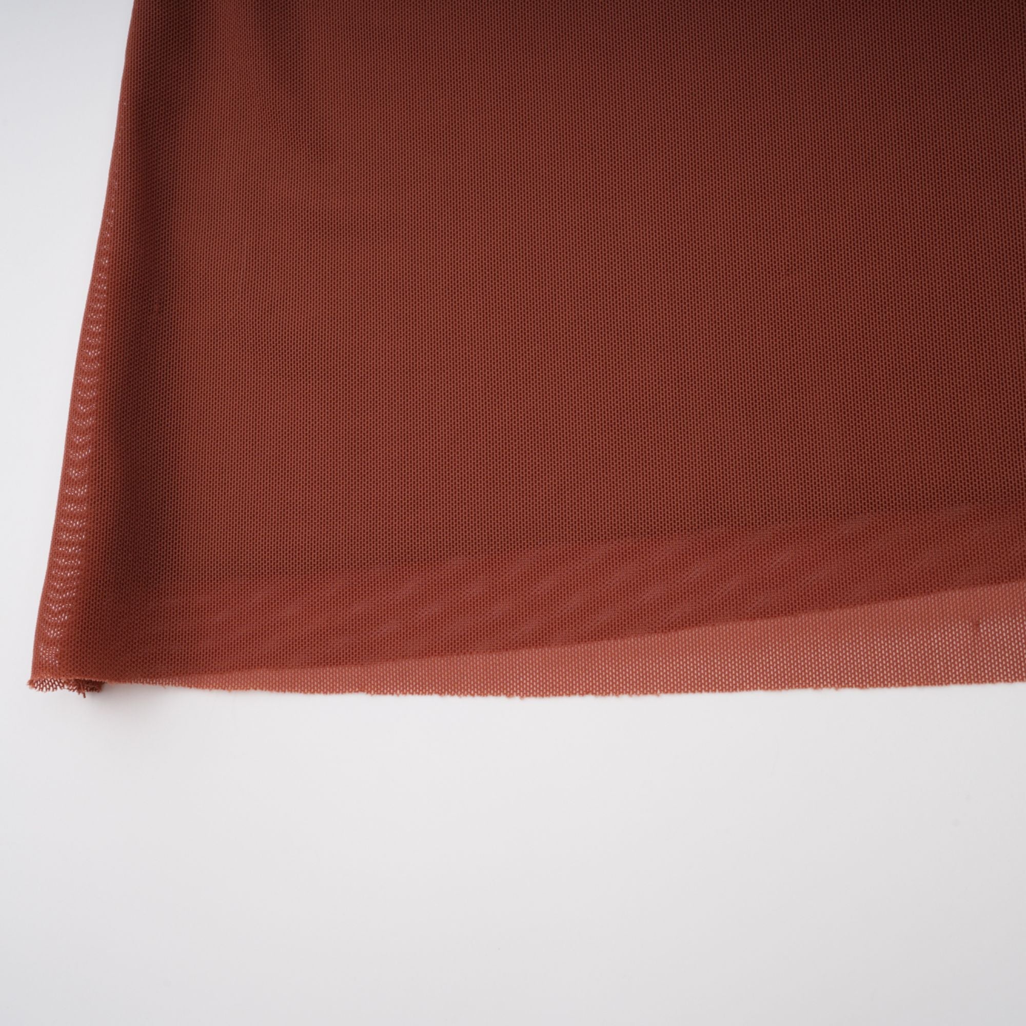 Rust-colored long-sleeve maxi dress with a draped cowl neckline and pleated bodice