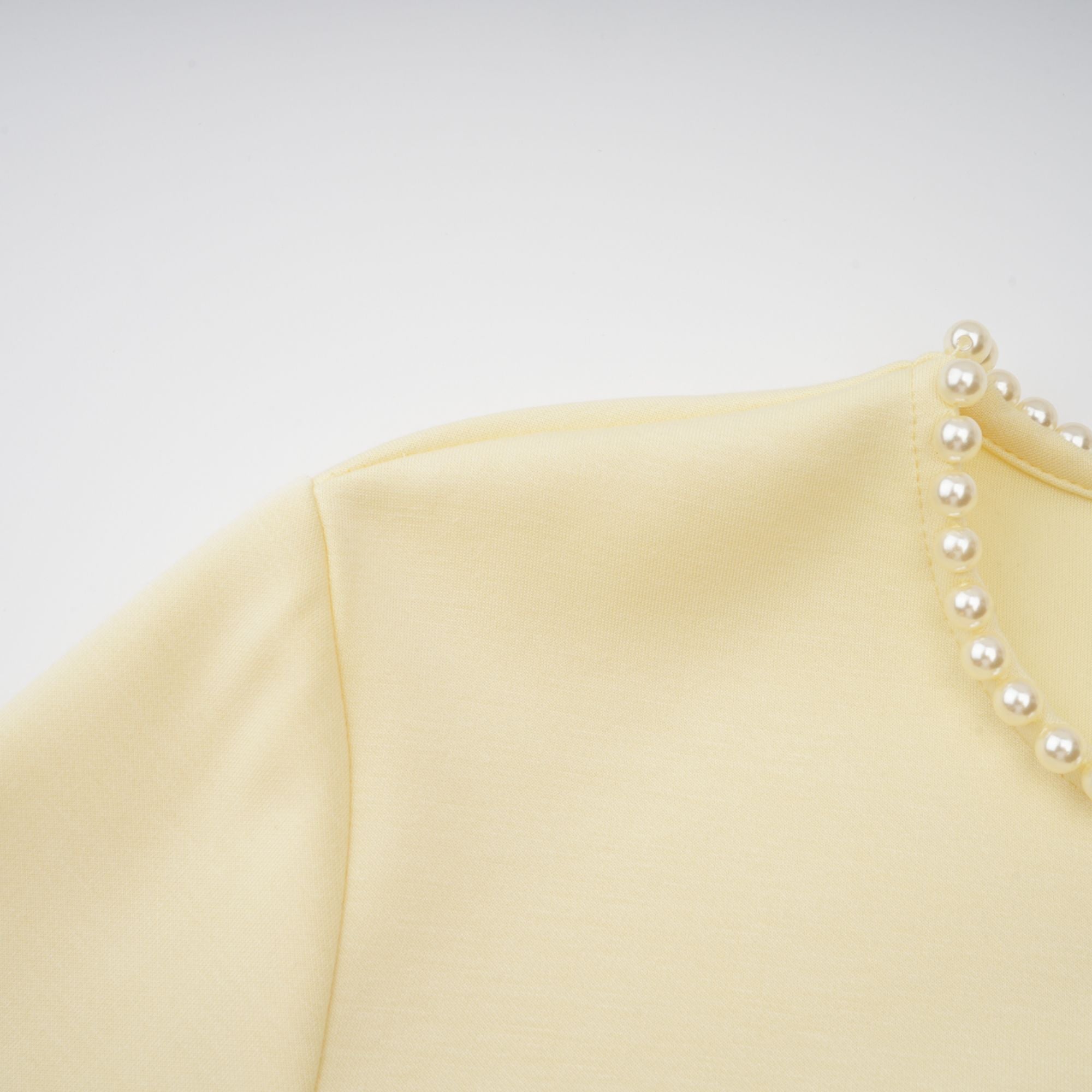 Light yellow long-sleeve maxi dress with a matching beaded cape overlay