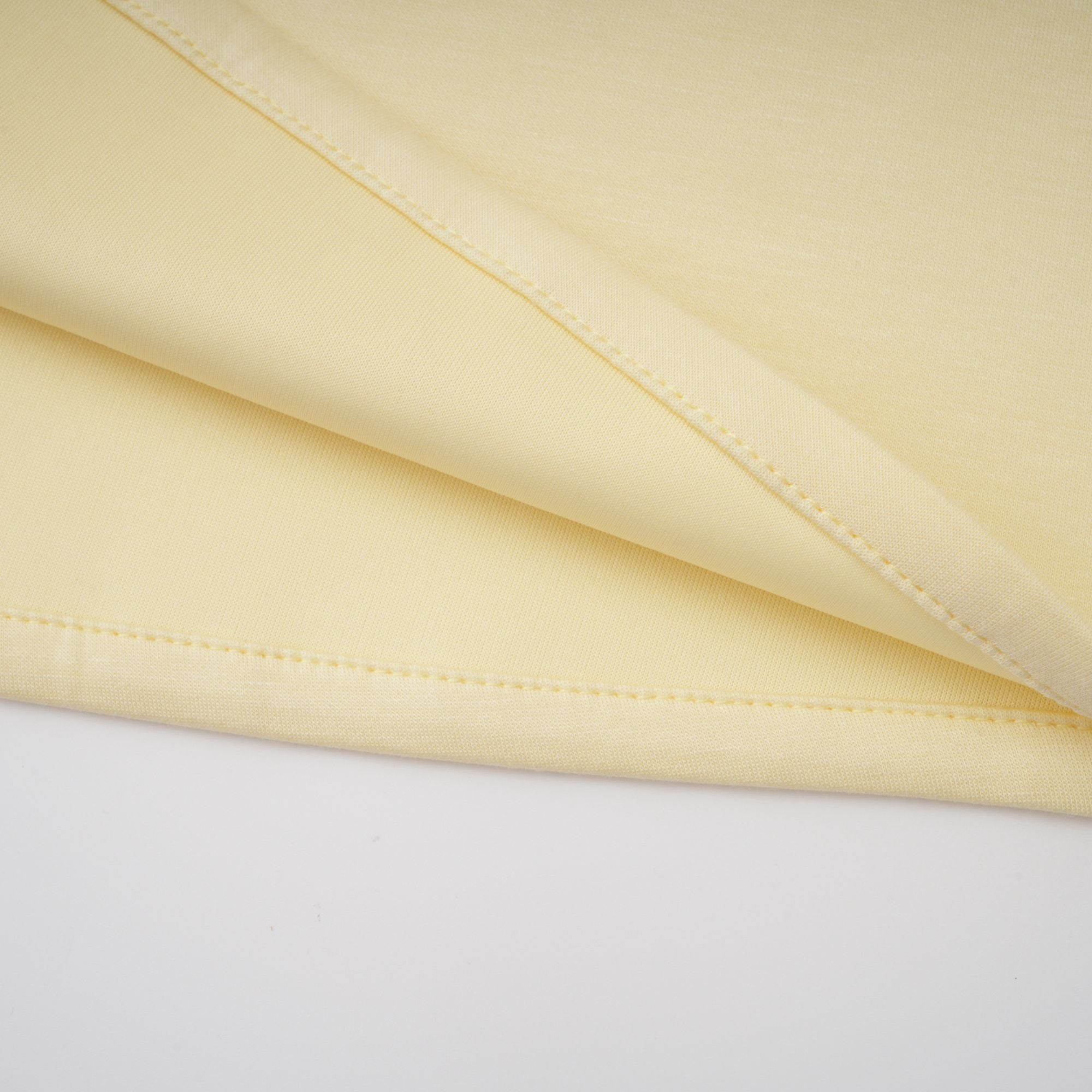 Light yellow long-sleeve maxi dress with a matching beaded cape overlay