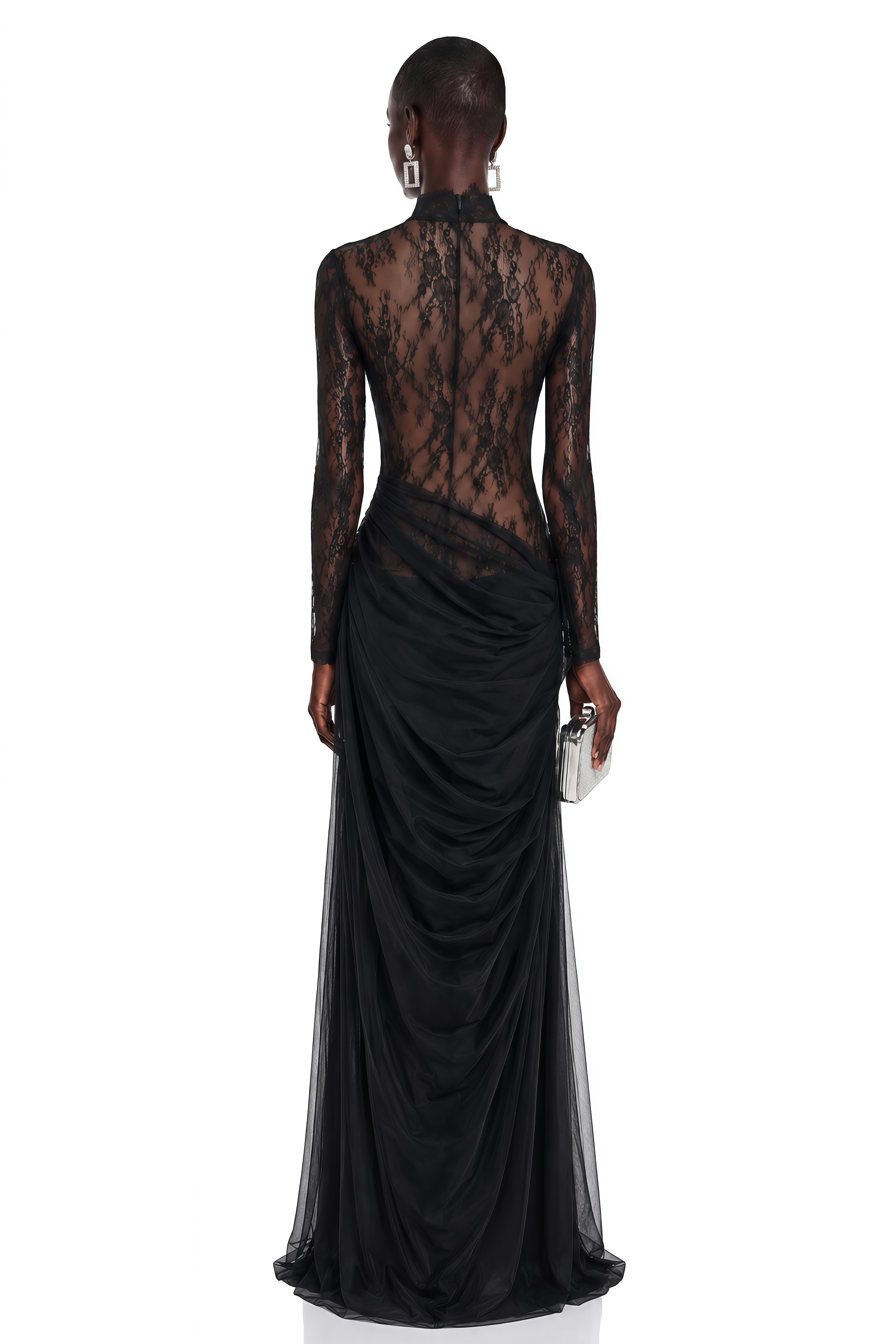 Black long-sleeve maxi dress with a sheer lace bodice and a draped skirt