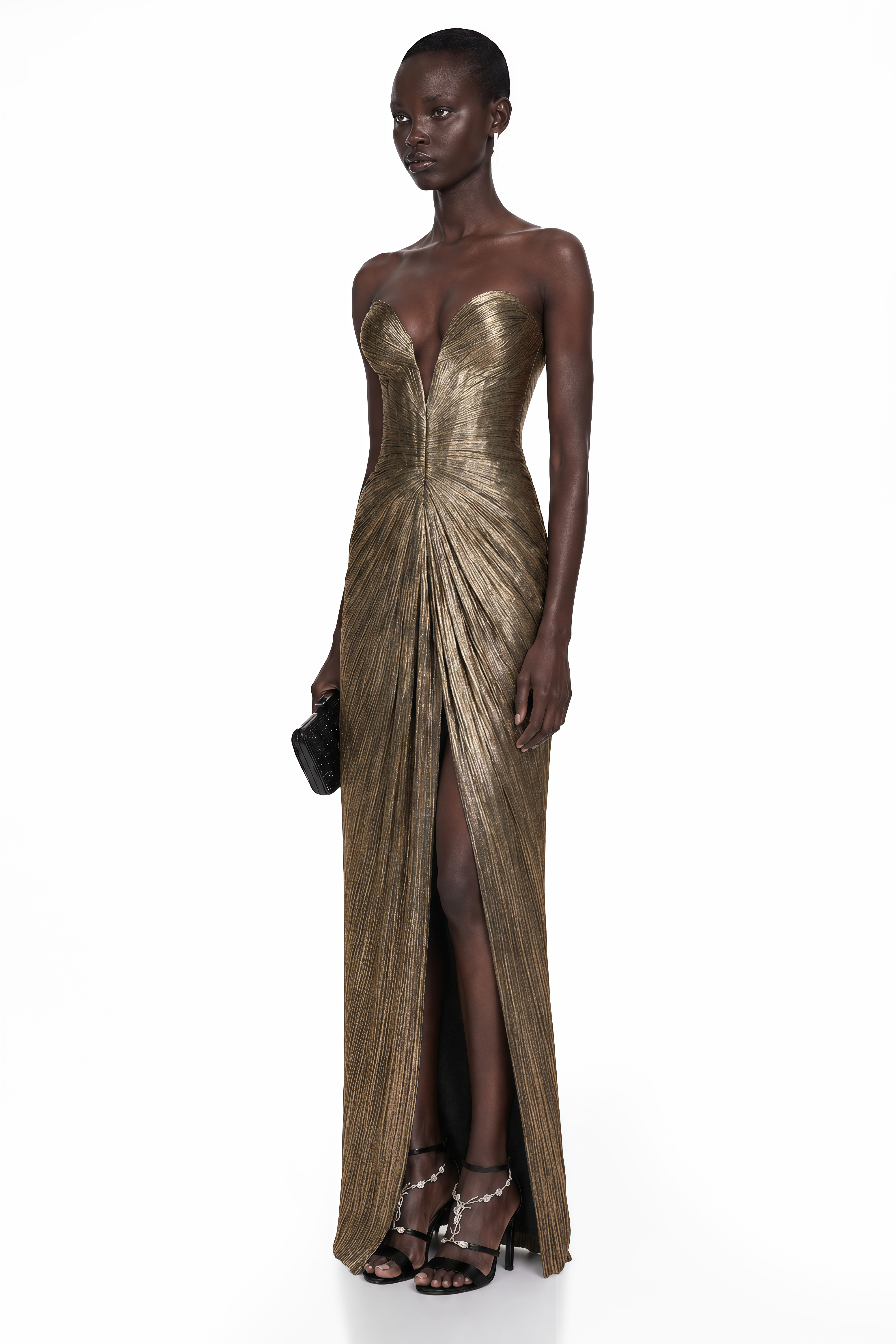 Antique gold strapless maxi dress with a plunging sweetheart neckline, pleated bodice, and a front leg slit
