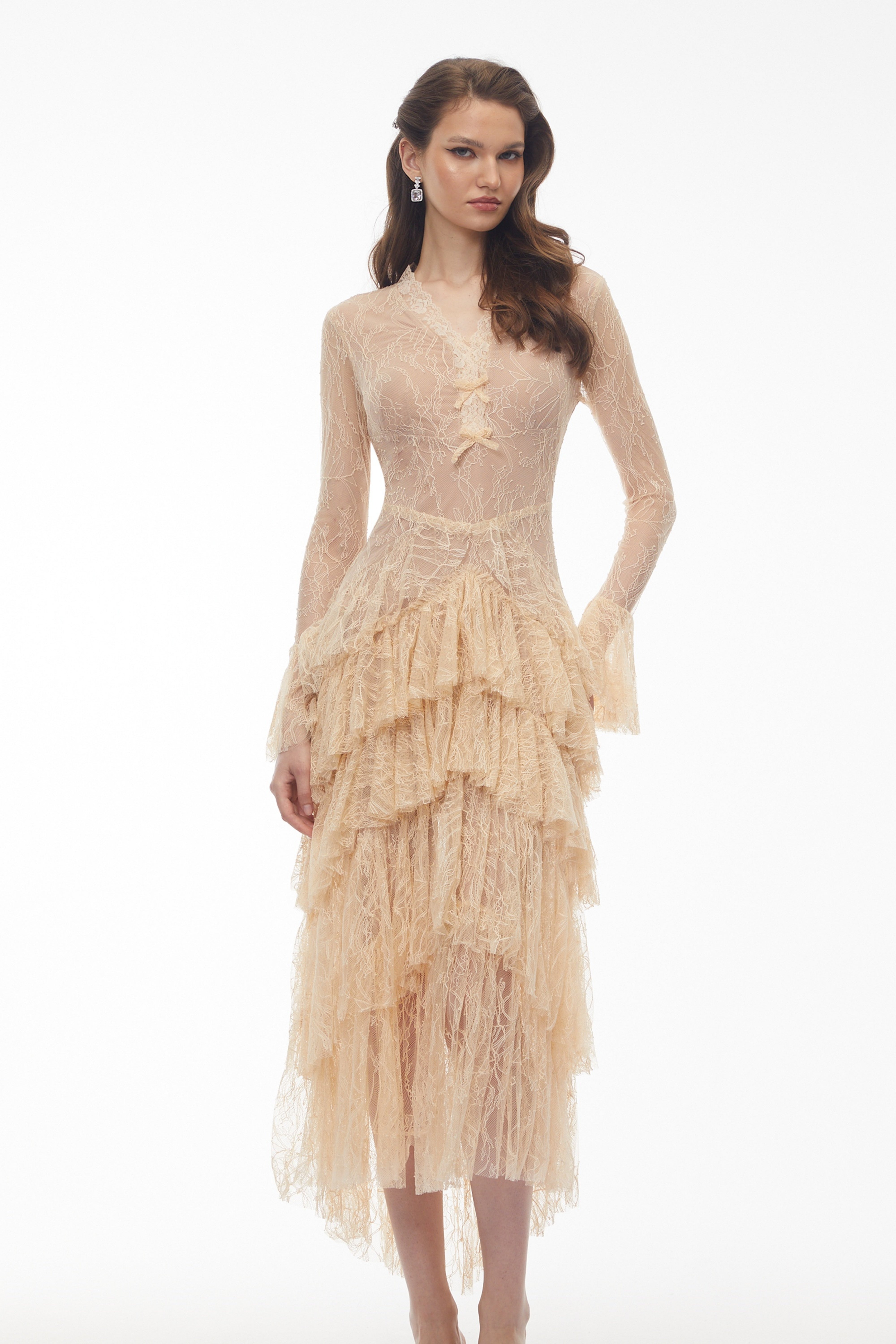 Beige lace gown with a tiered ruffled skirt