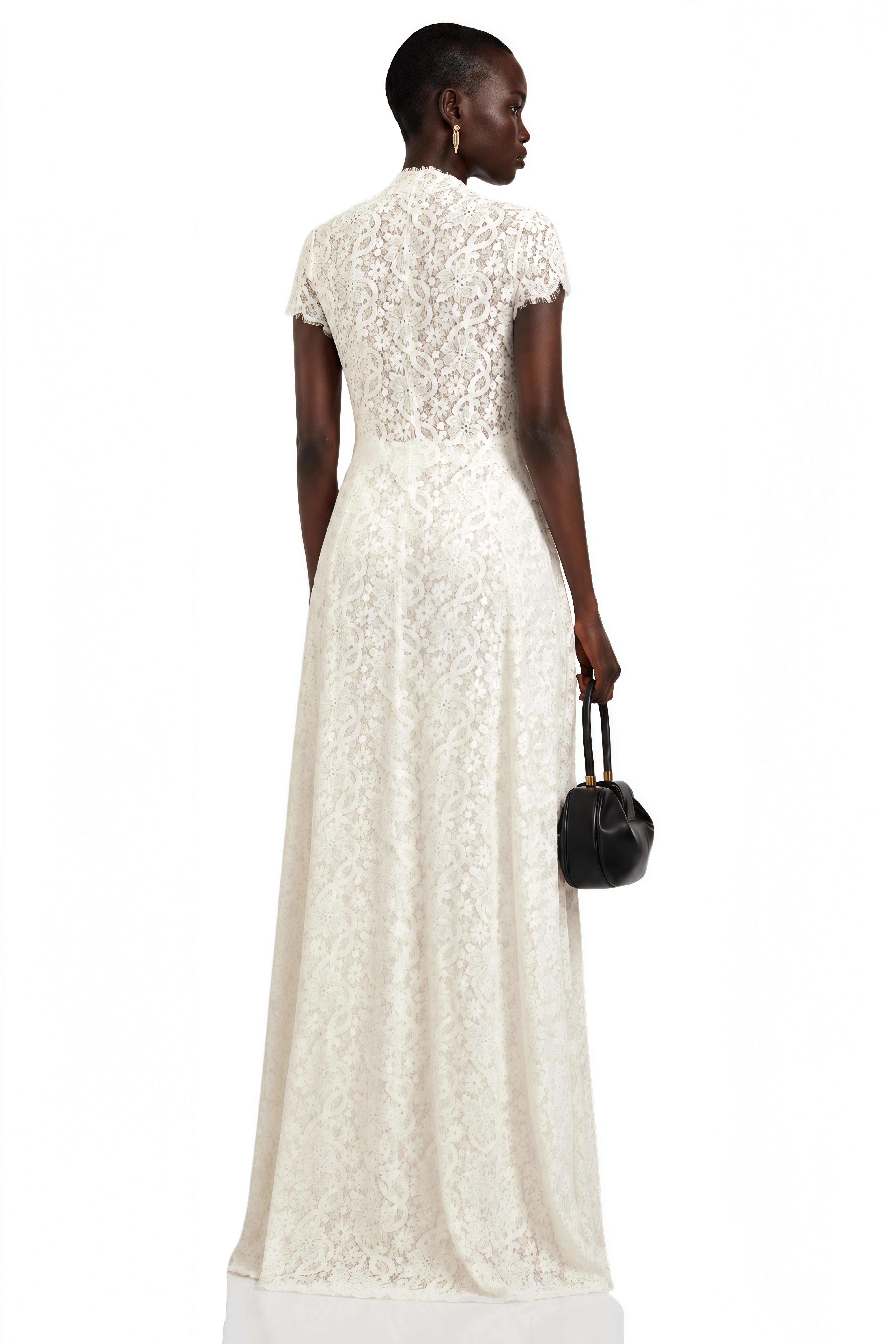 Black long-sleeve maxi dress with a sheer lace bodice and a draped skirt