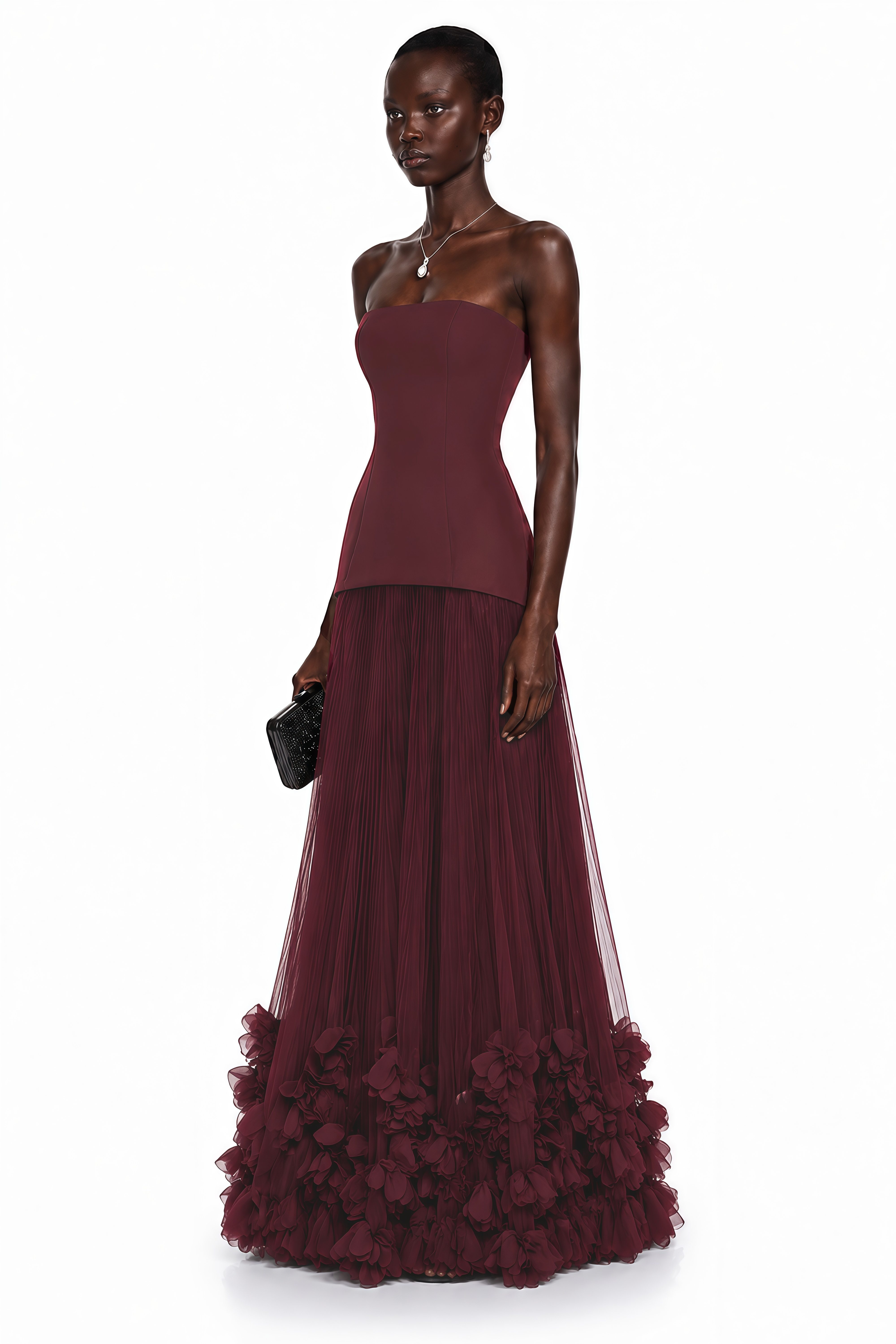 Burgundy strapless maxi dress with a drop-waist bodice and pleated tulle skirt featuring a ruffled hem