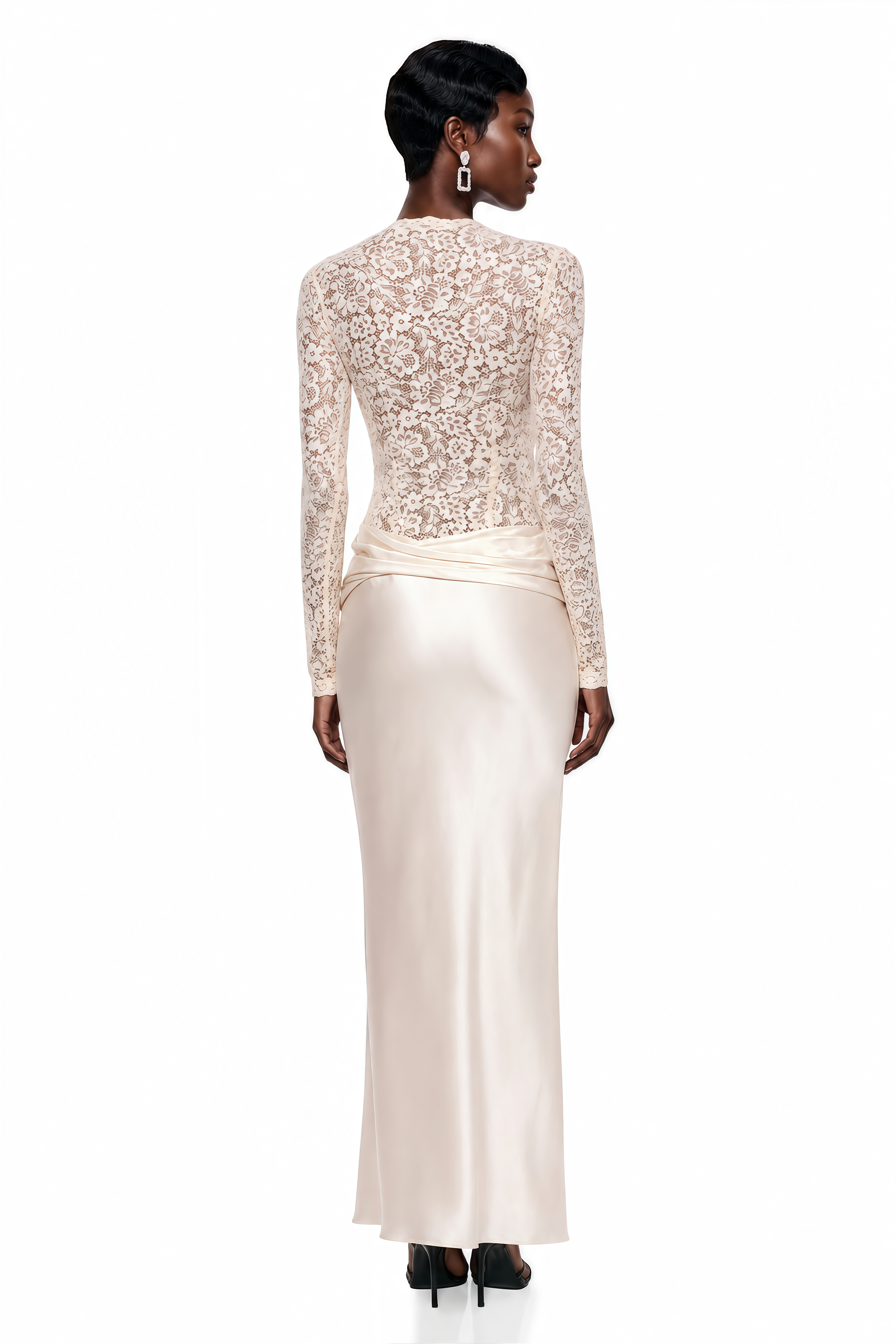 Cream maxi dress featuring a long-sleeve floral lace bodice and a draped satin floor-length skirt