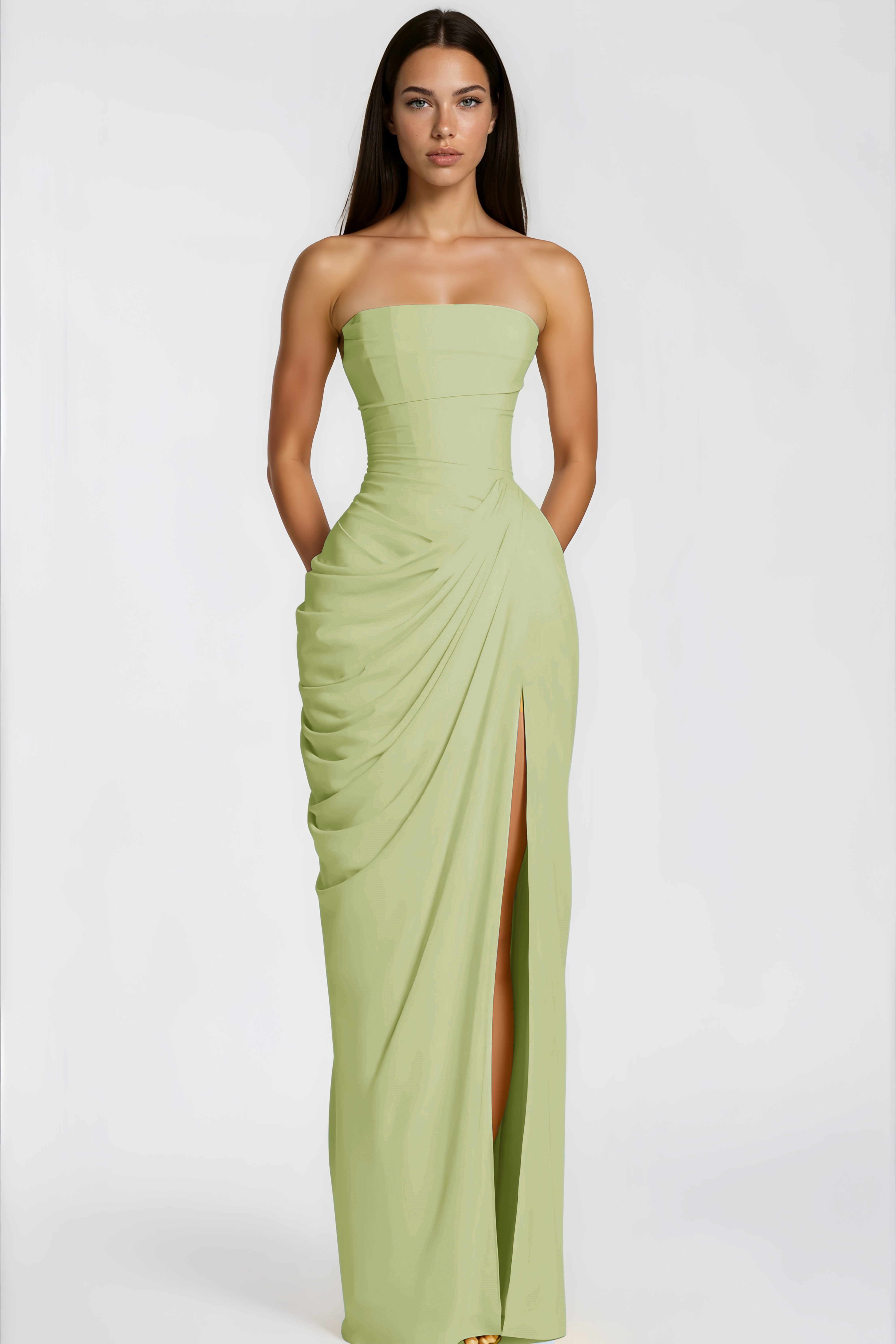 Sage green strapless maxi dress featuring a structured bodice and a draped wrap skirt with a high slit