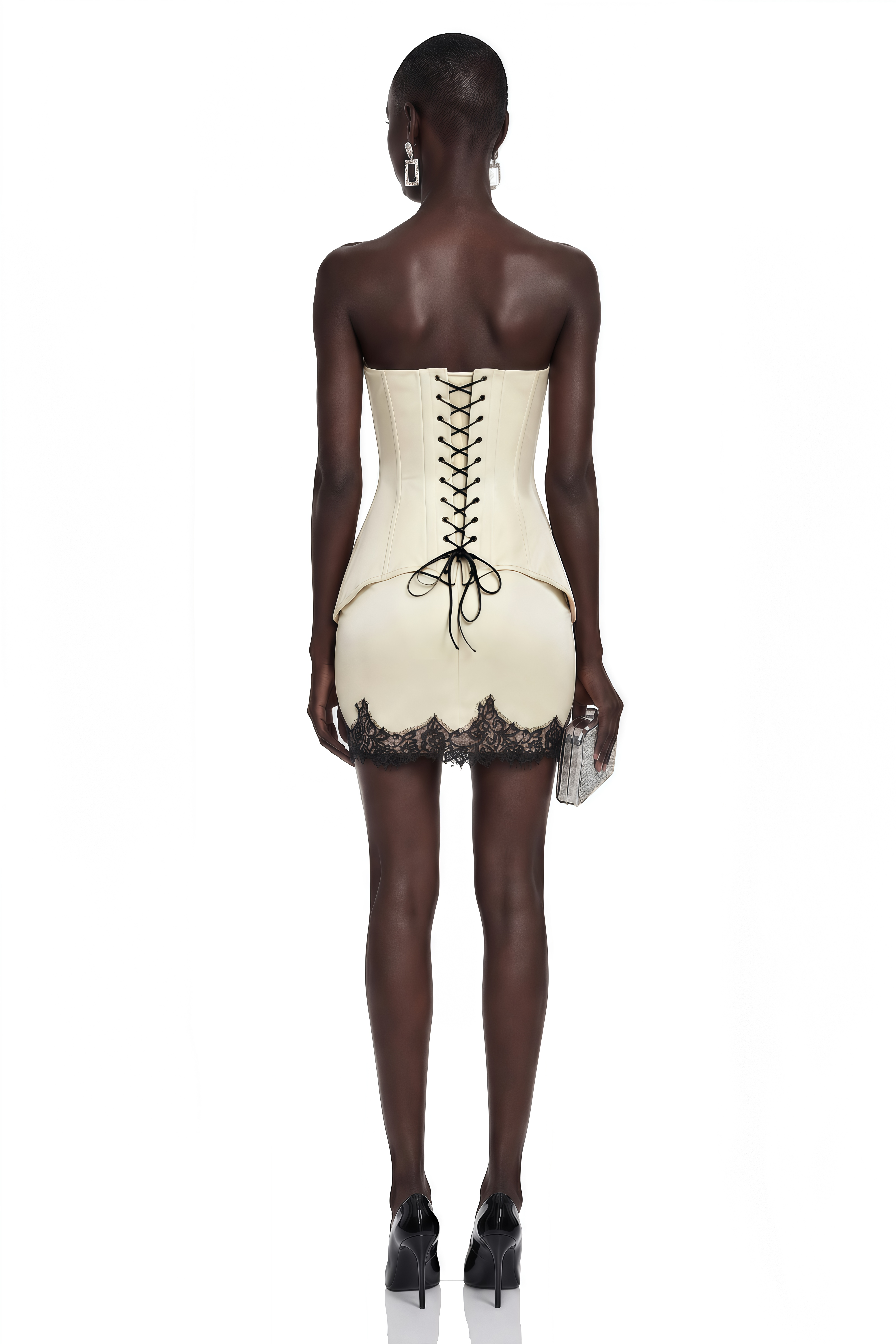 Cream strapless mini dress with a peplum corset and black lace trim