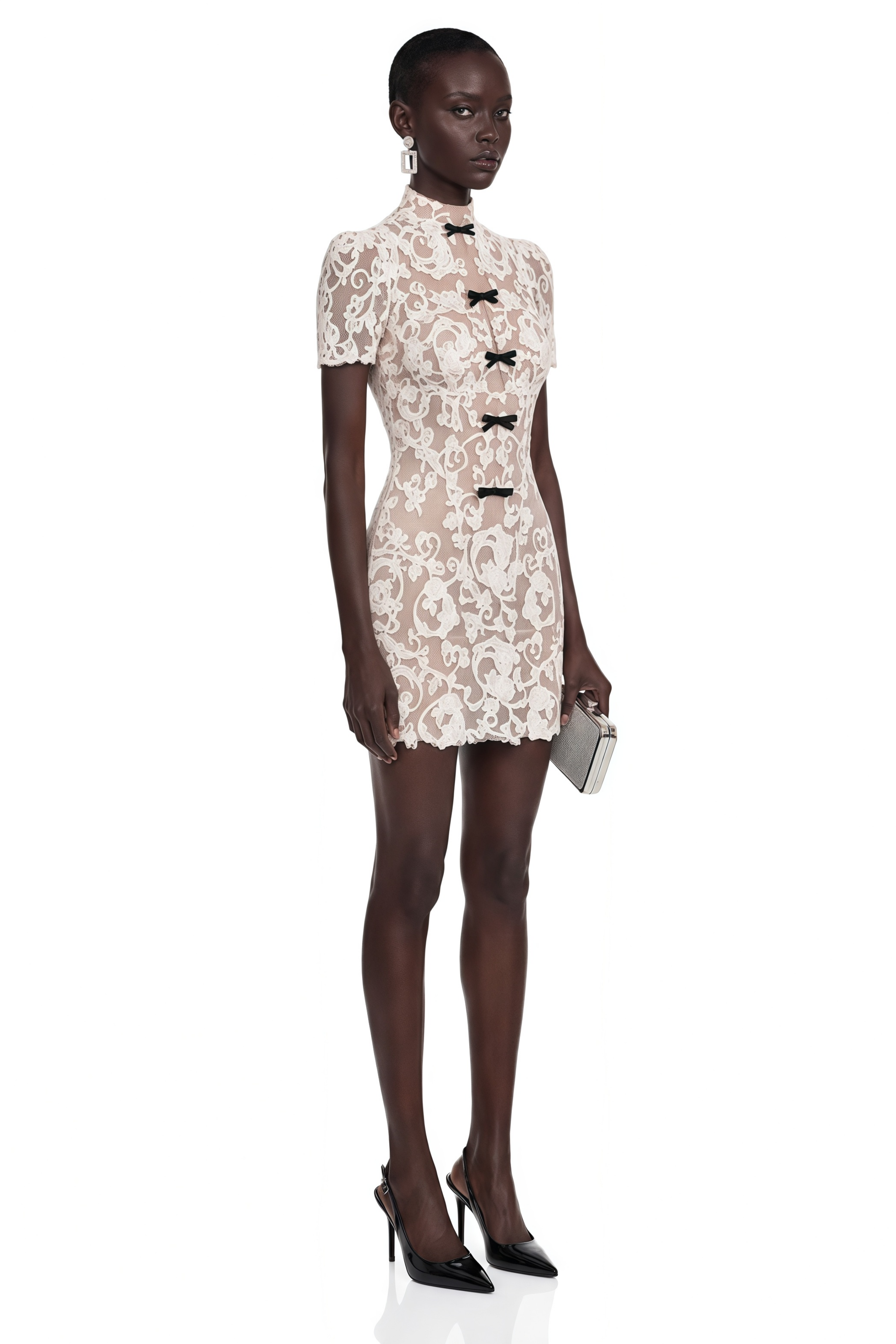 Cream lace high-neck mini dress with short sleeves and front black bow details