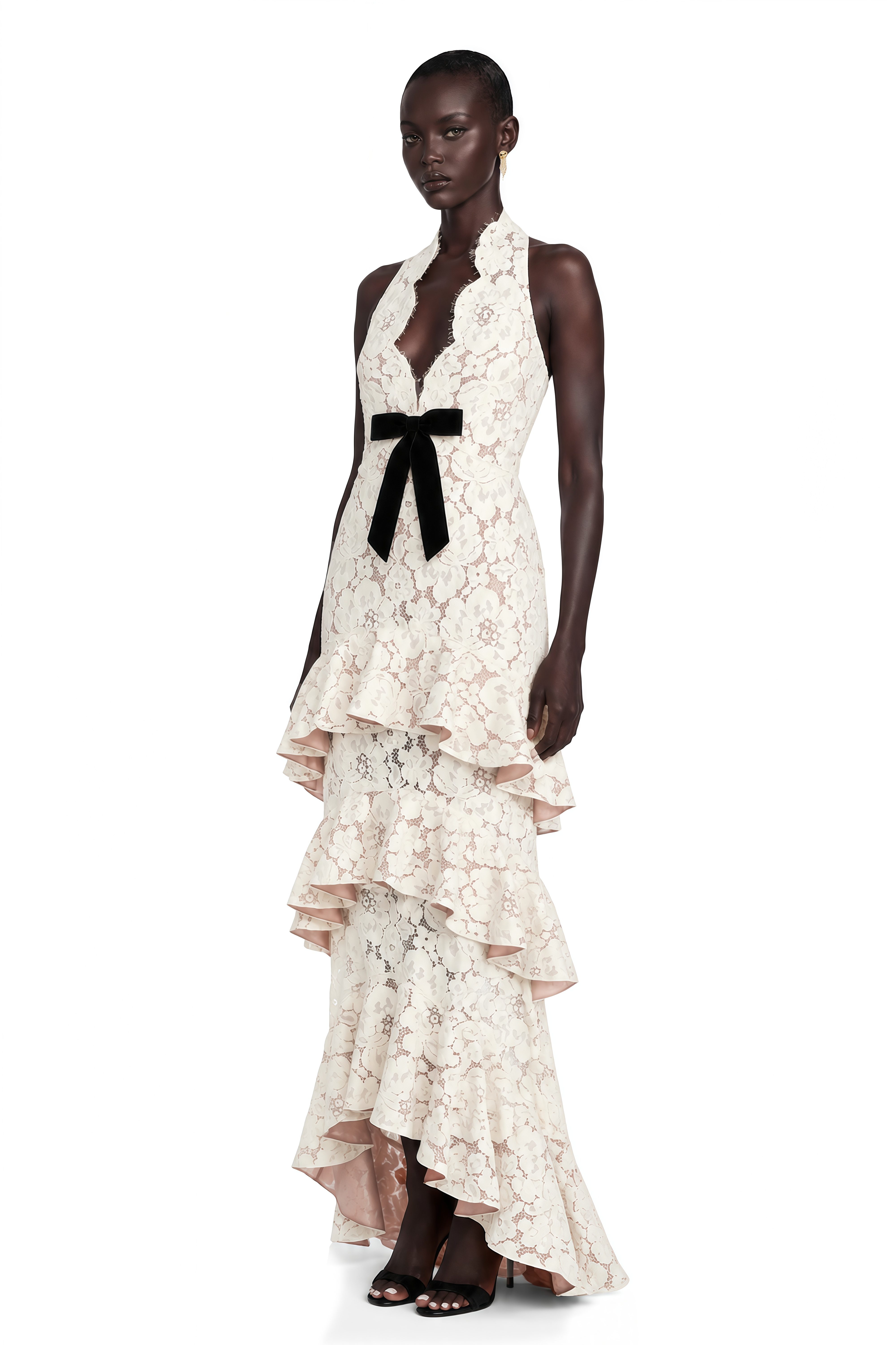 Cream lace halter maxi dress with a black bow and tiered ruffled skirt
